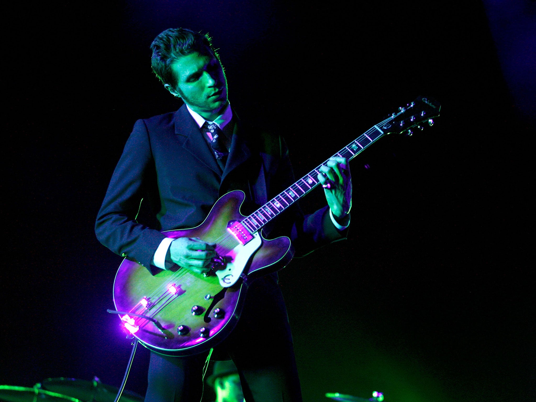 Daniel Kessler of Interpol performs at Coachella in 2007