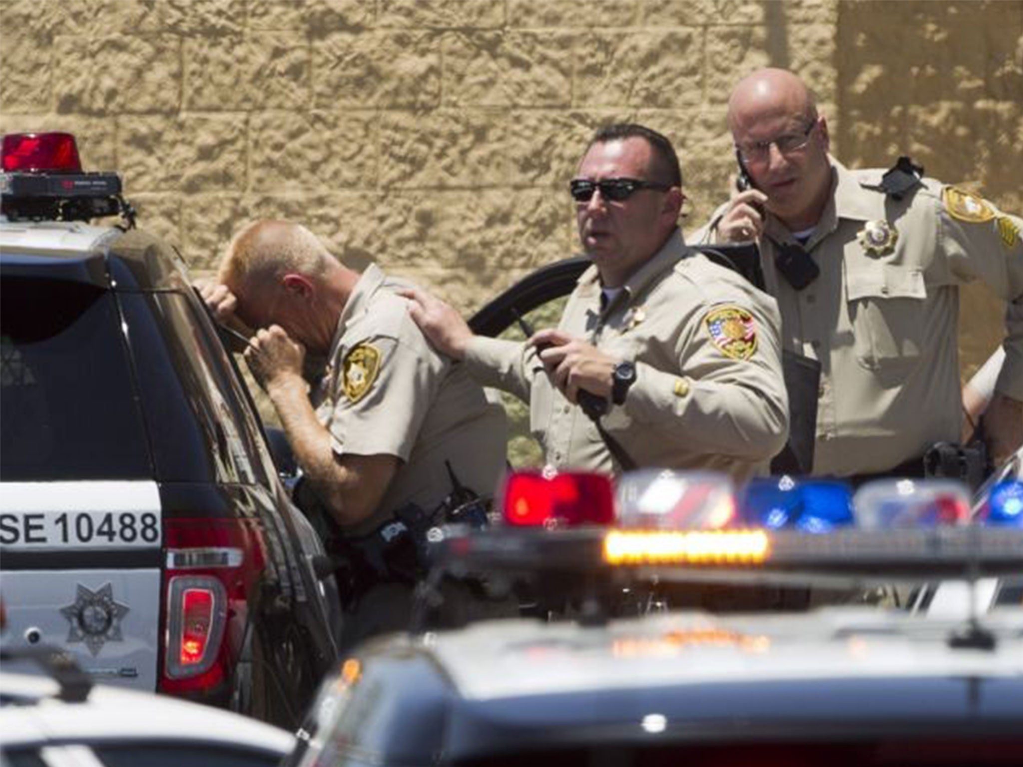 Police officers outside a Las Vegas Wal-Mart after the shooting that left two officers dead