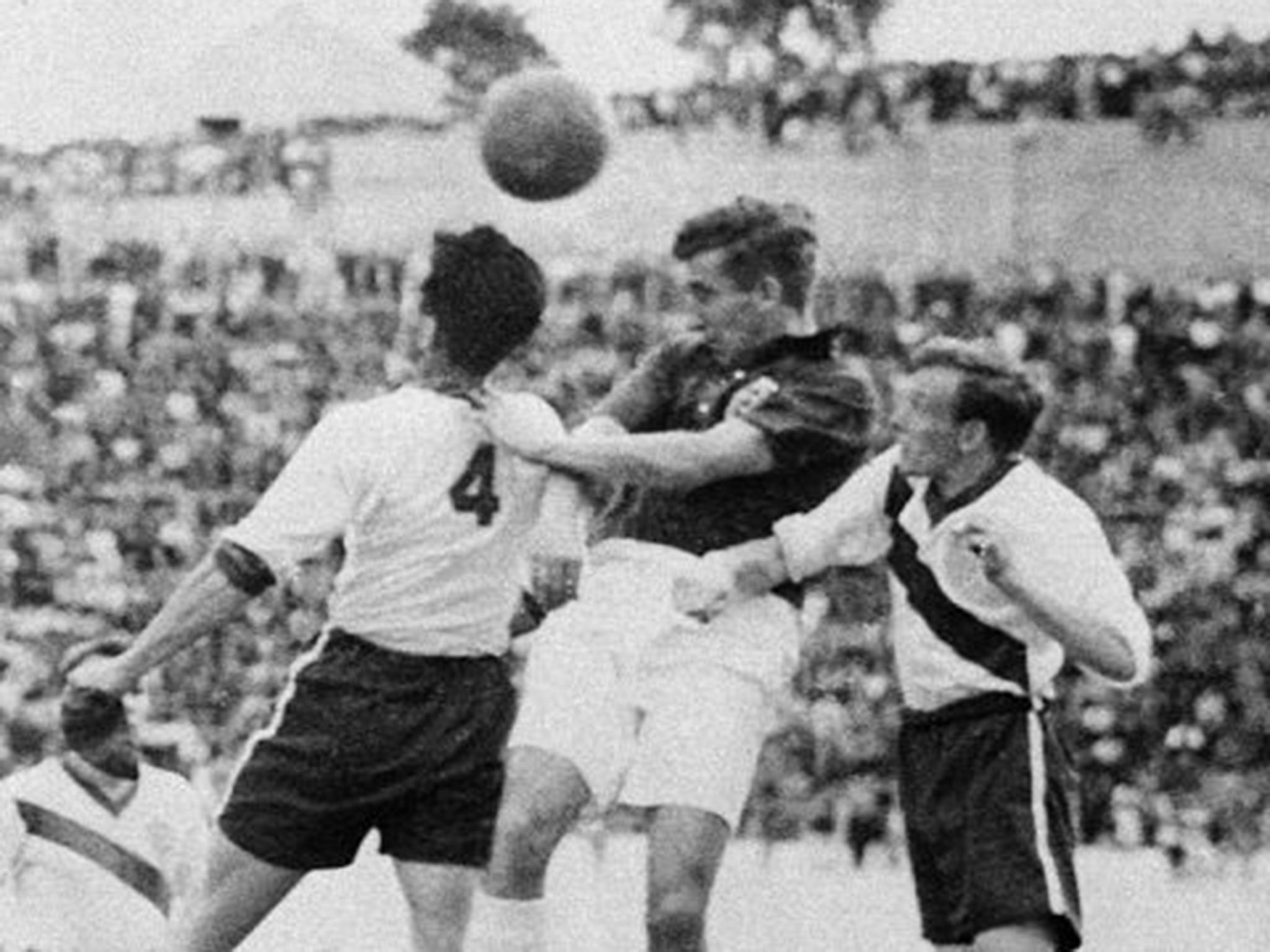 Tom Finney, centre, wins a header during England’s 1950 defeat to the United States