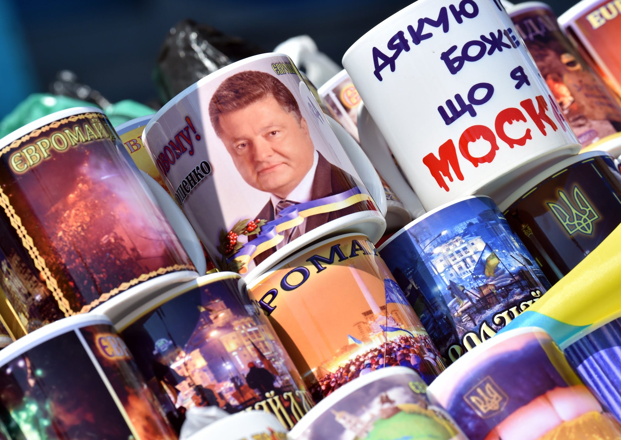 A mug with Poroshenko's face on it marks the new Ukranian president's inauguration