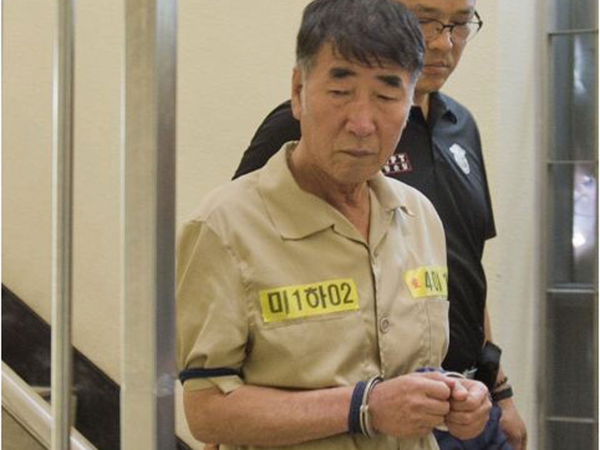 Lee Joon-seok, captain of sunken ferry Sewol, arrives at a court in Gwangju