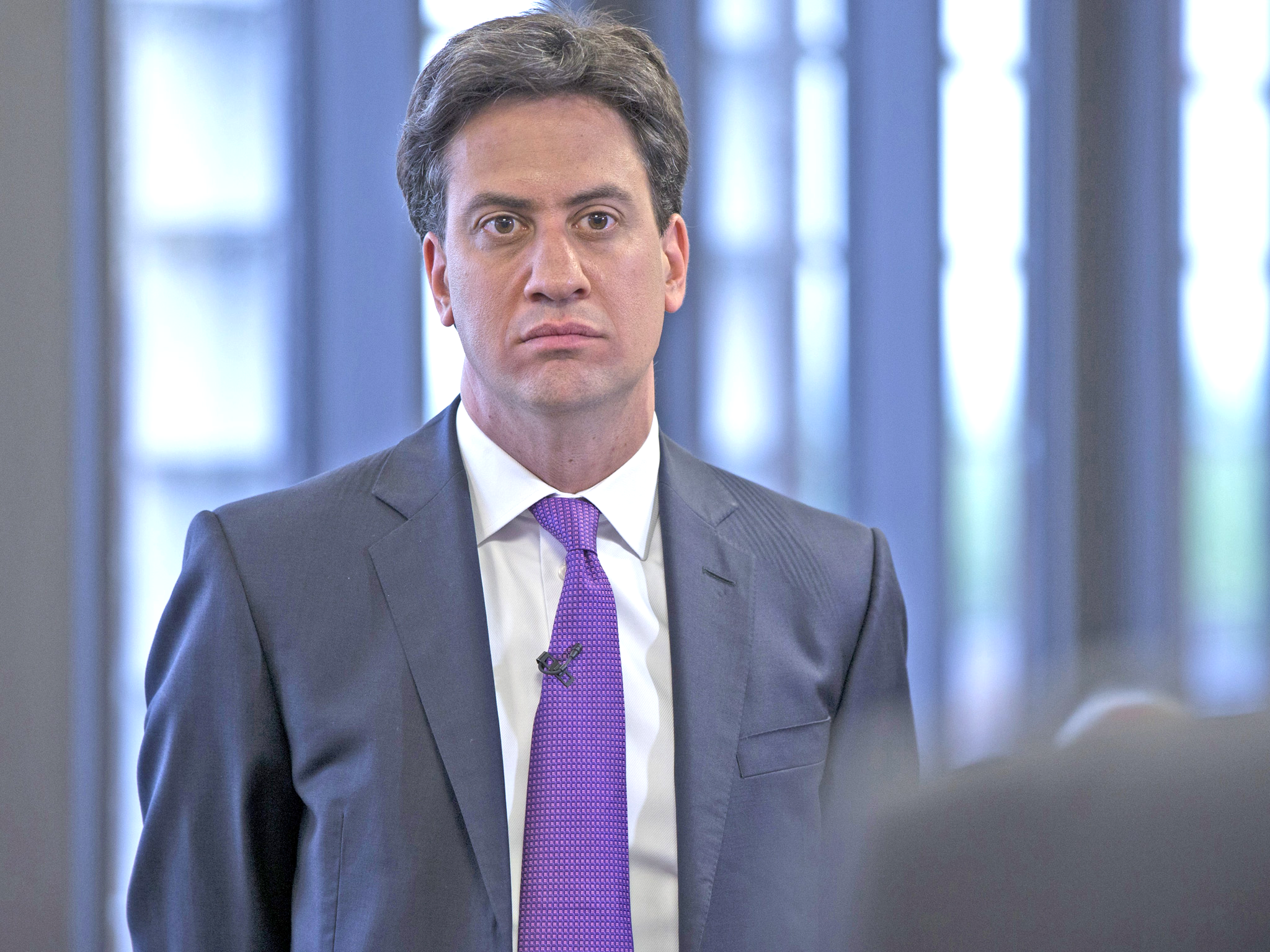 Ed Miliband has apologised for any offence he may have caused when posing with a copy of the Sun, after Labour figures expressed criticism at the move.