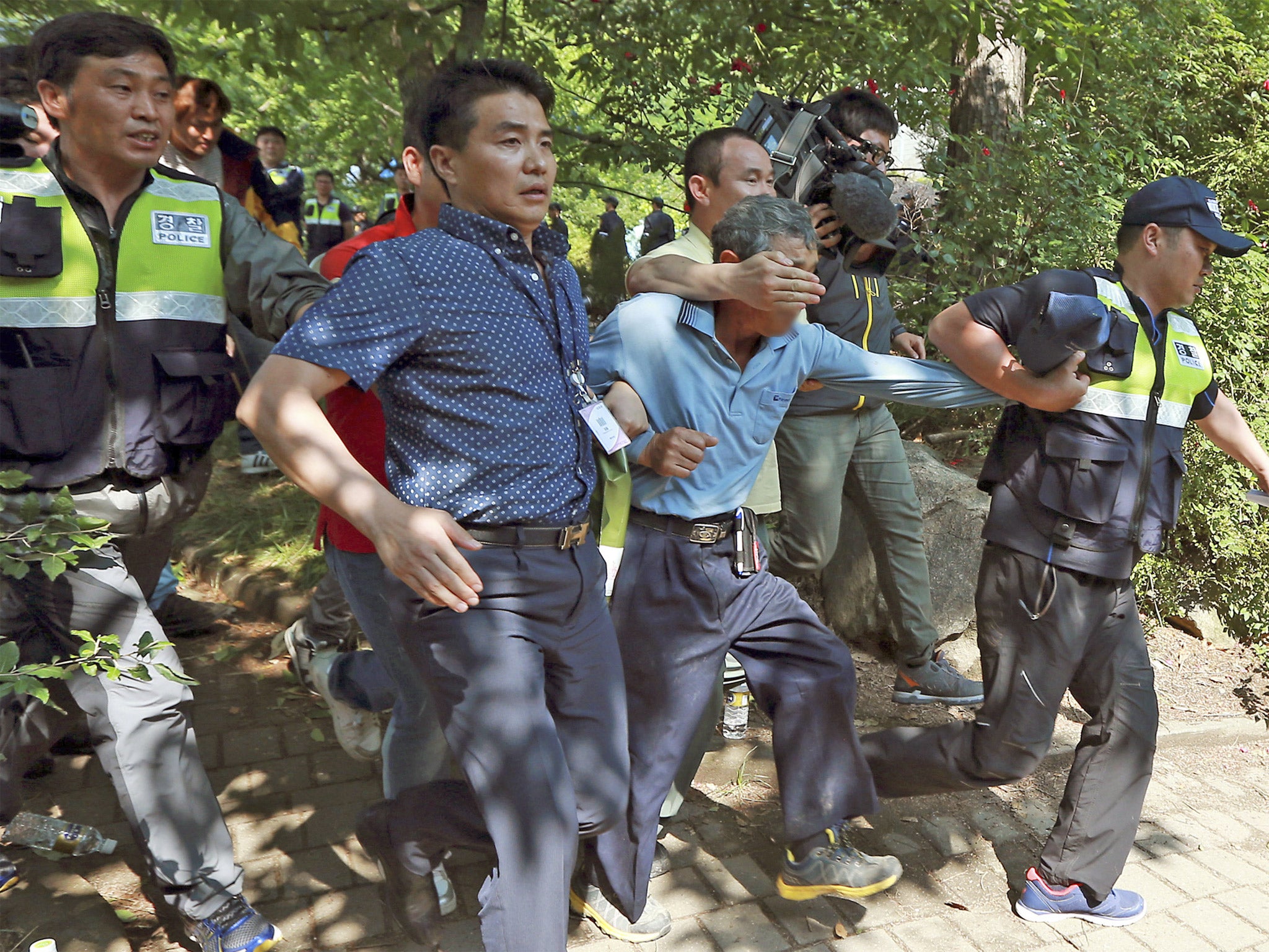 Police officers make arrests at the church in Anseong, South Korea