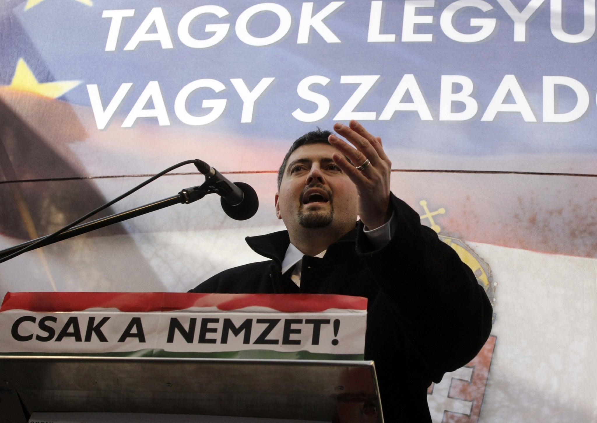 sanad Szegedi delivers a speech to his supporters during a demonstration entitled 'To be members, or to be free?