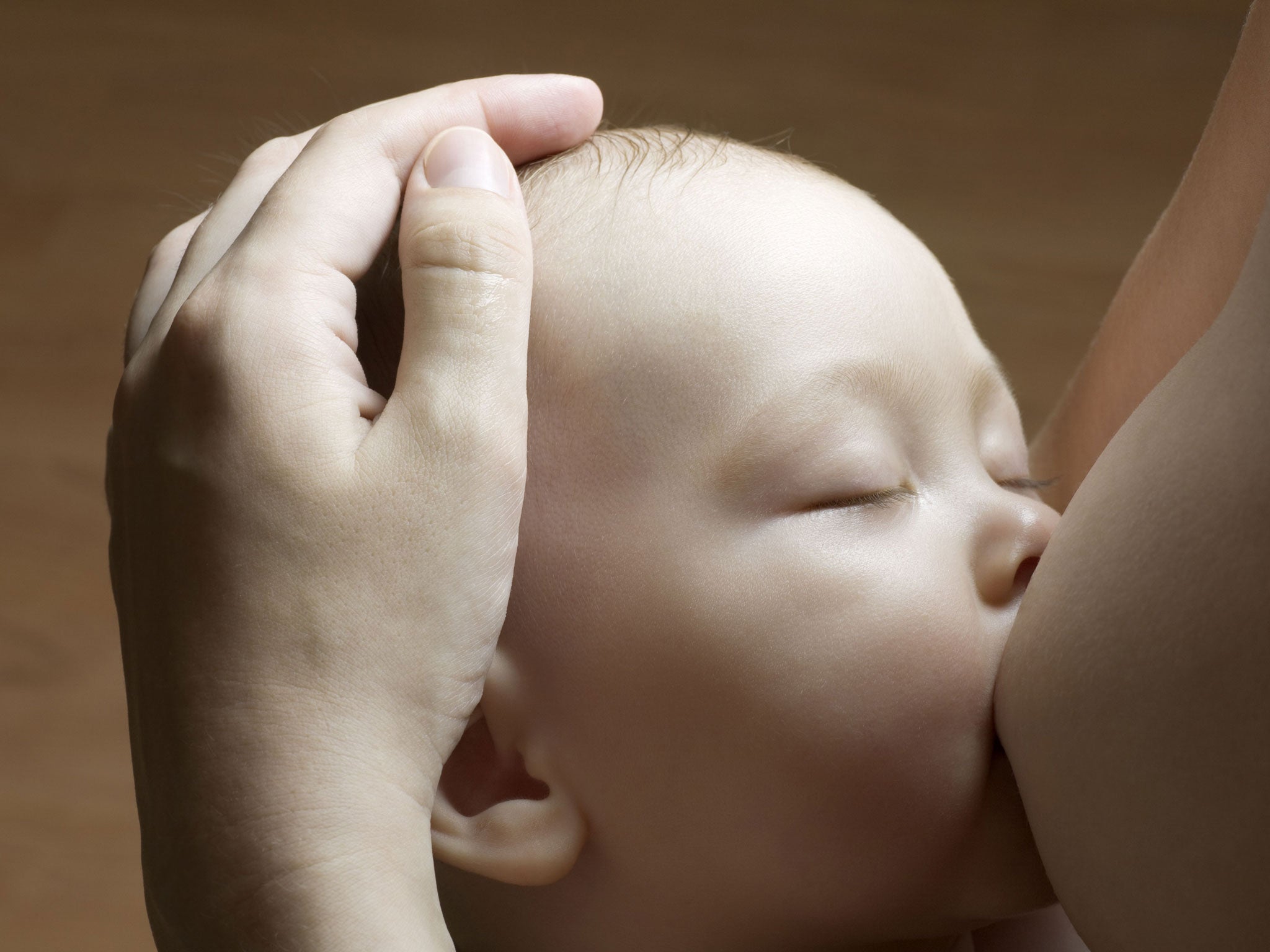 A mother breastfeeding her baby