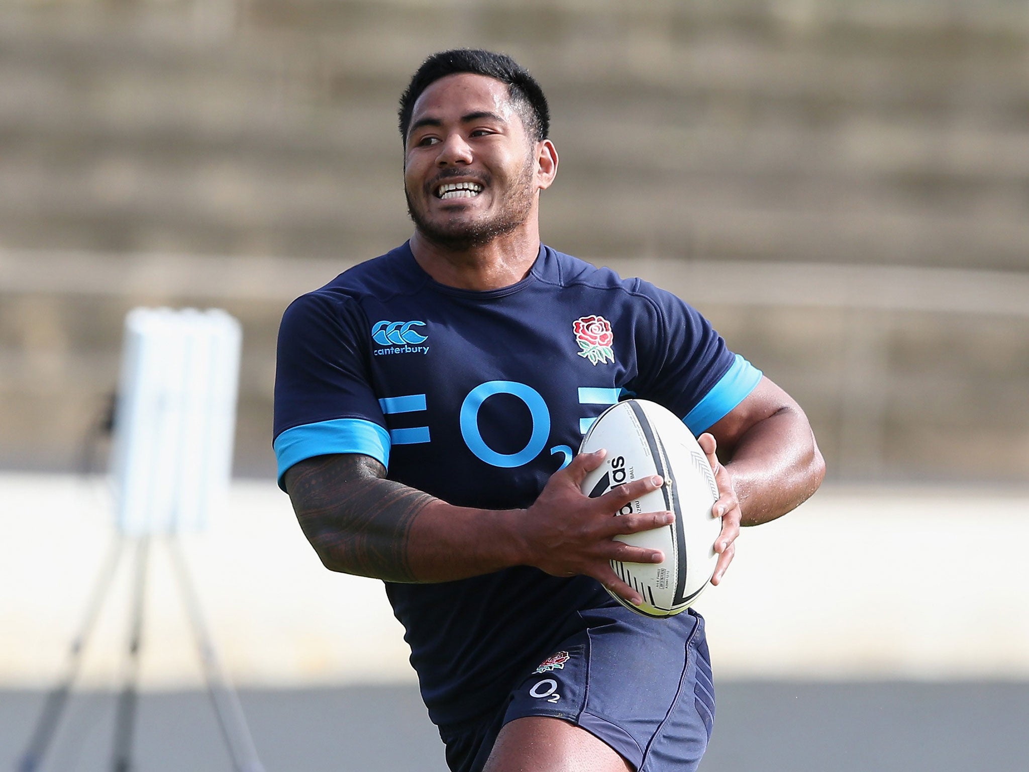 Manu Tuilagi runs with the ball during the England training session