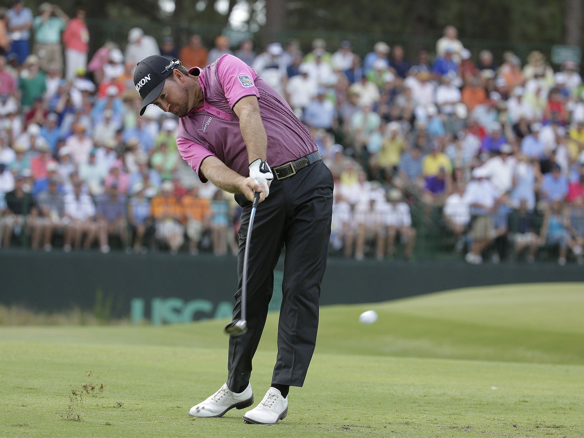 Graeme McDowell hits his tee shot on the 13th at Pinehurst yesterday