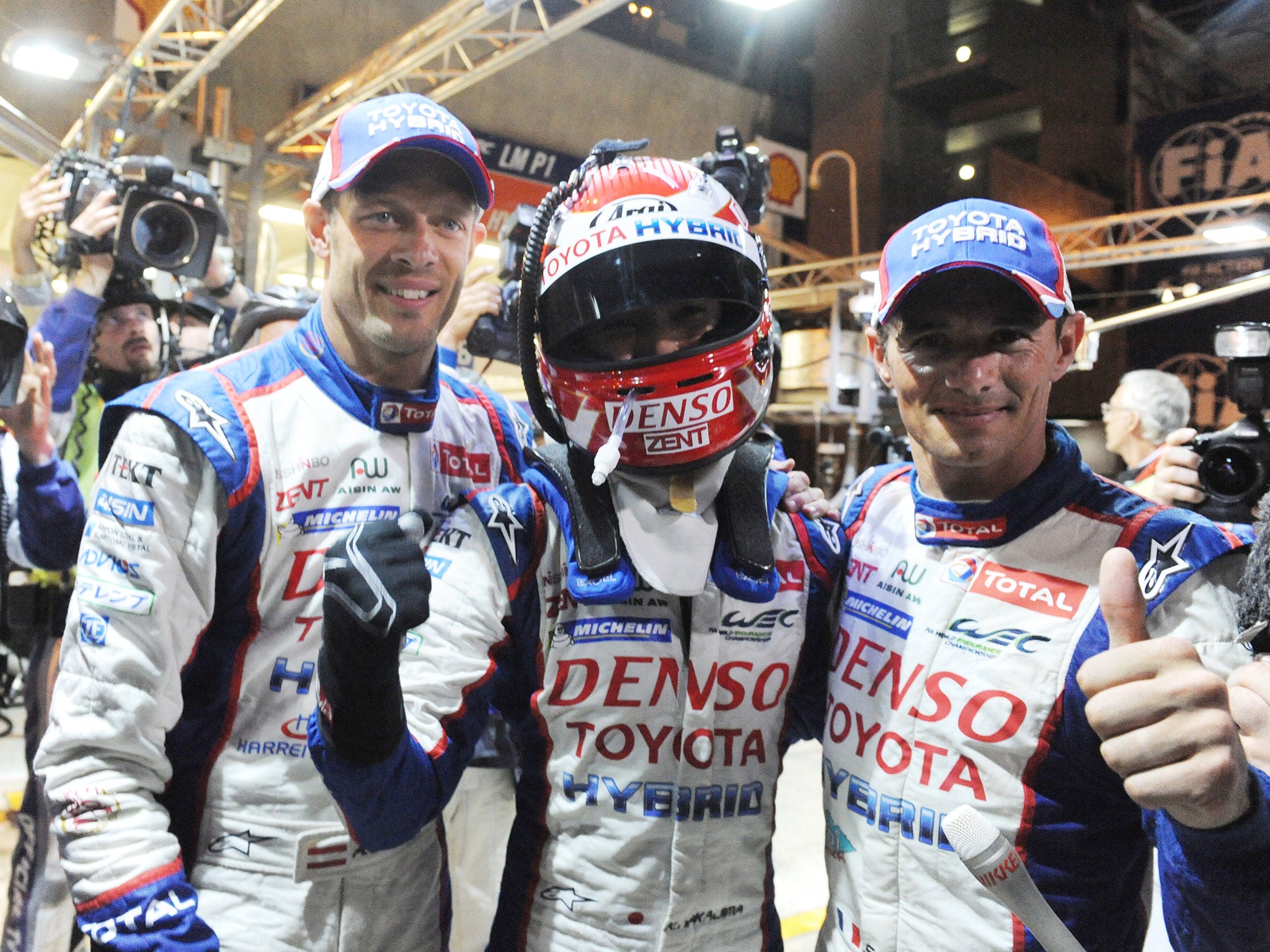 Nakajima is congratulated by his teammates Wurz and Sarrazin