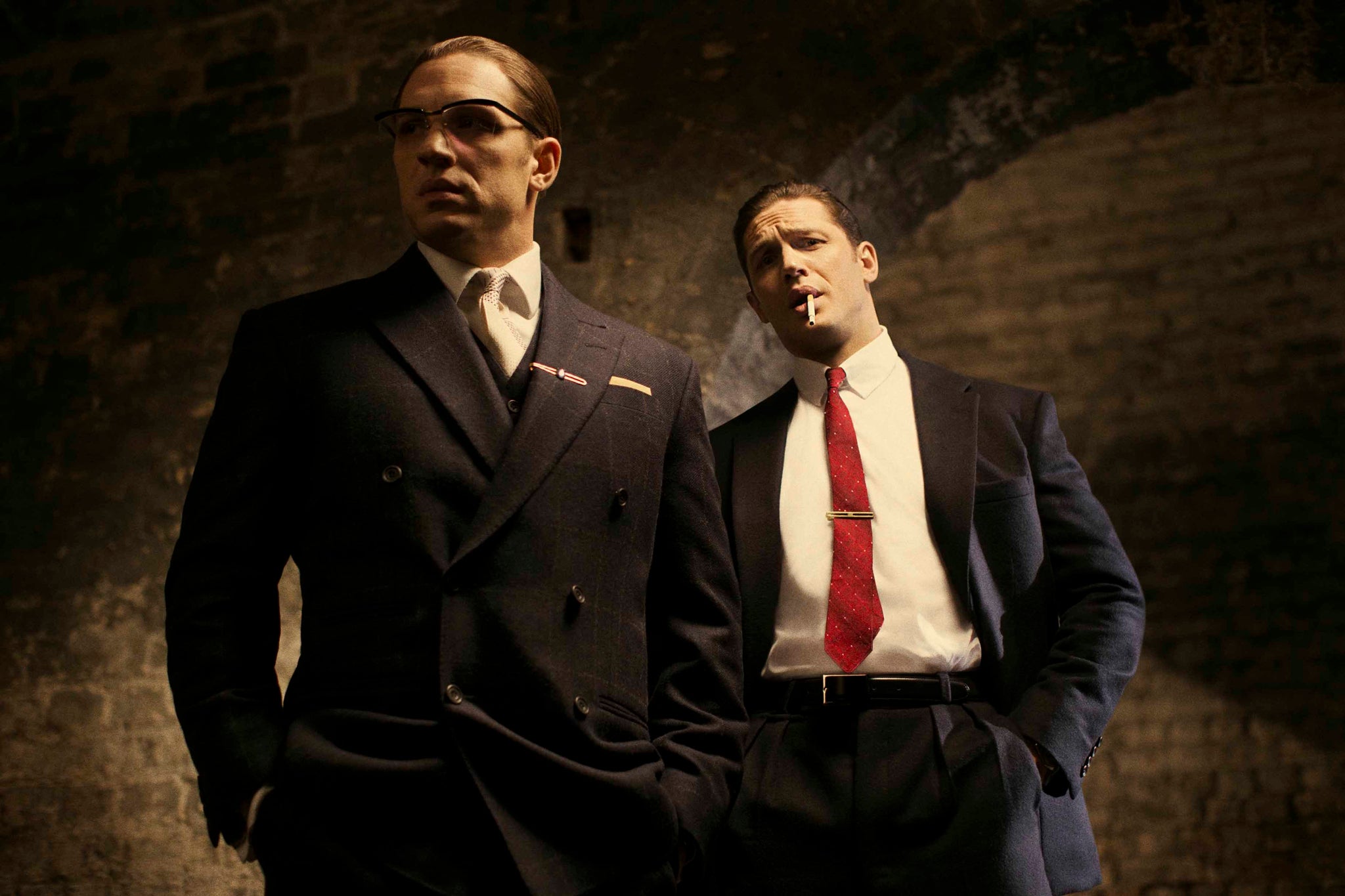 Tom Hardy as Ronnie (left) and Reggie Kray in new film 'Legend'