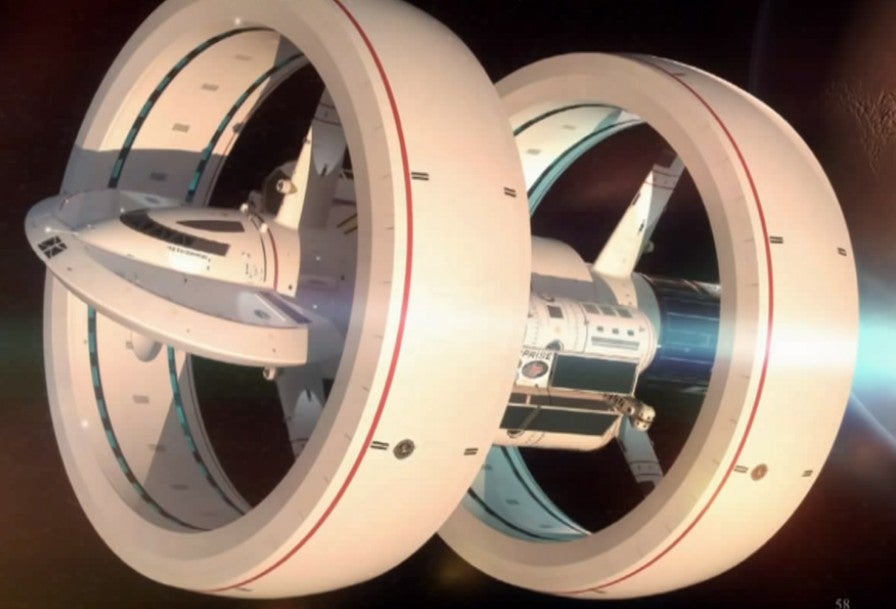 A zoomed out illustration of the faster-than-light craft. The donut-like bands are what would be used to create the warp bubble in which it would travel. Credit: Marl Rademaker