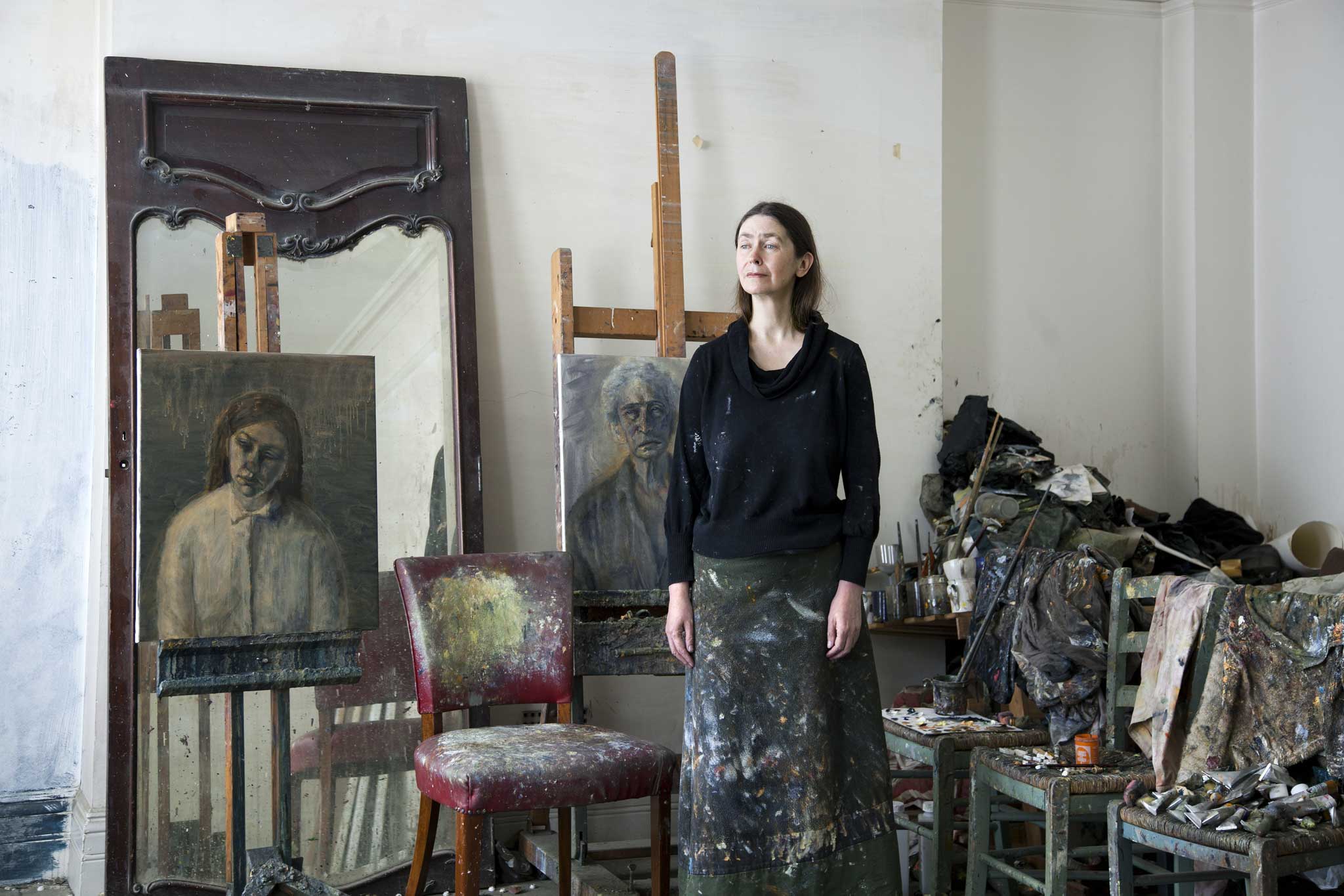 In the frame: Celia Paul in her flat and studio in Bloomsbury, with the 2014 portraits 'Steve' (left) and 'Alice' (Celia Paul)