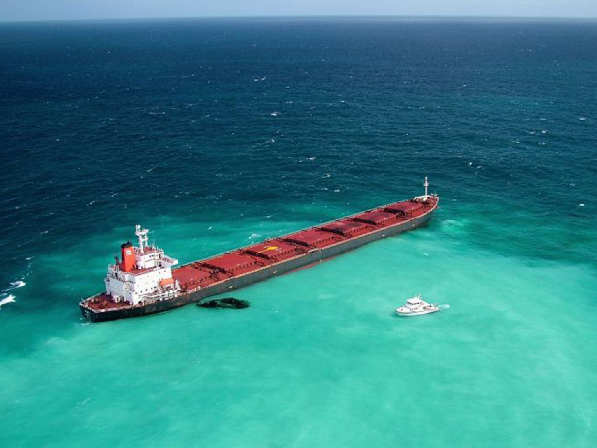 Dirty business: A grounded coal carrier leaks oil on the Great Barrier Reef in 2010