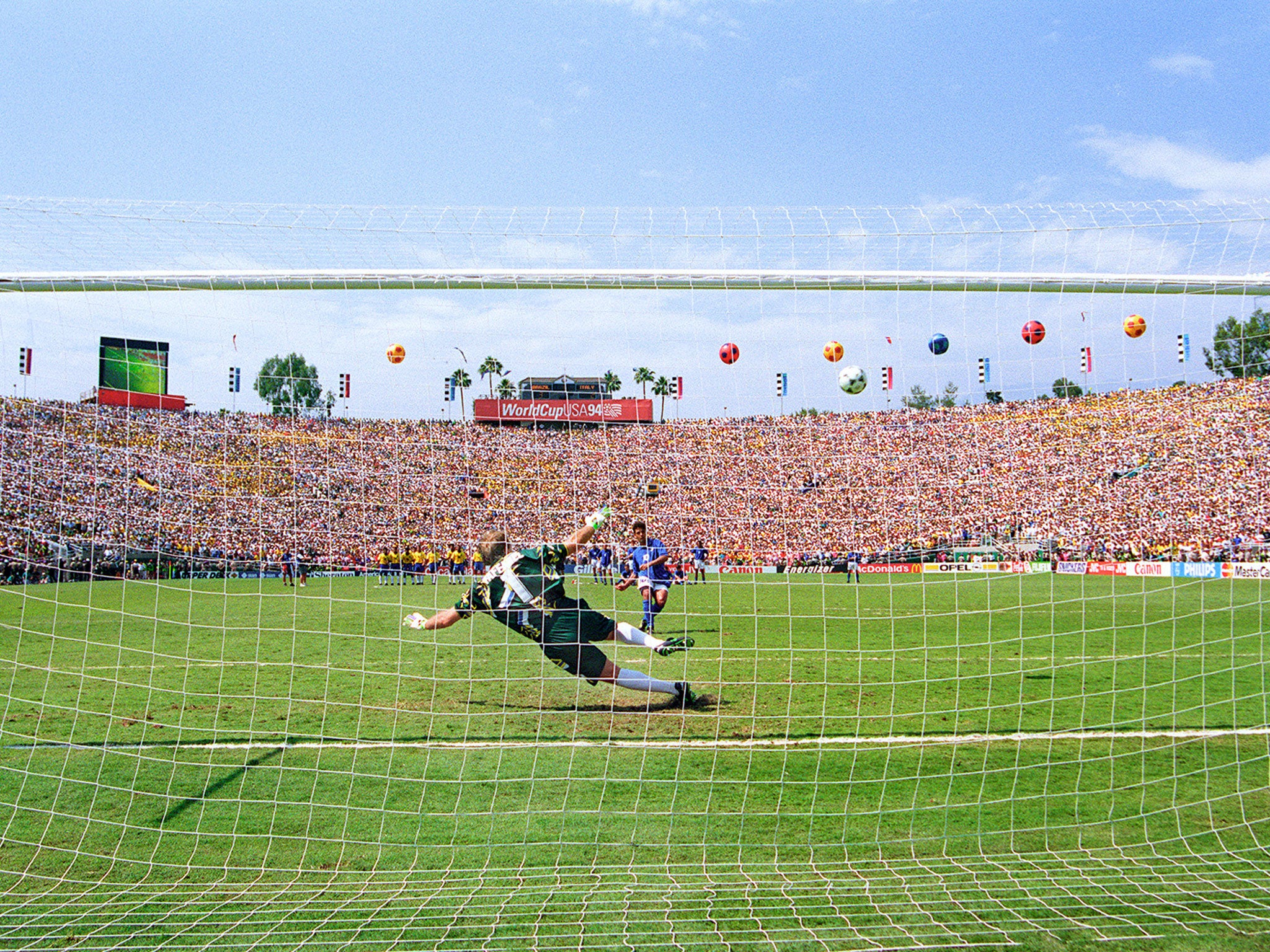 Italian forward Roberto Baggio watches his penalty kick go over the crossbar