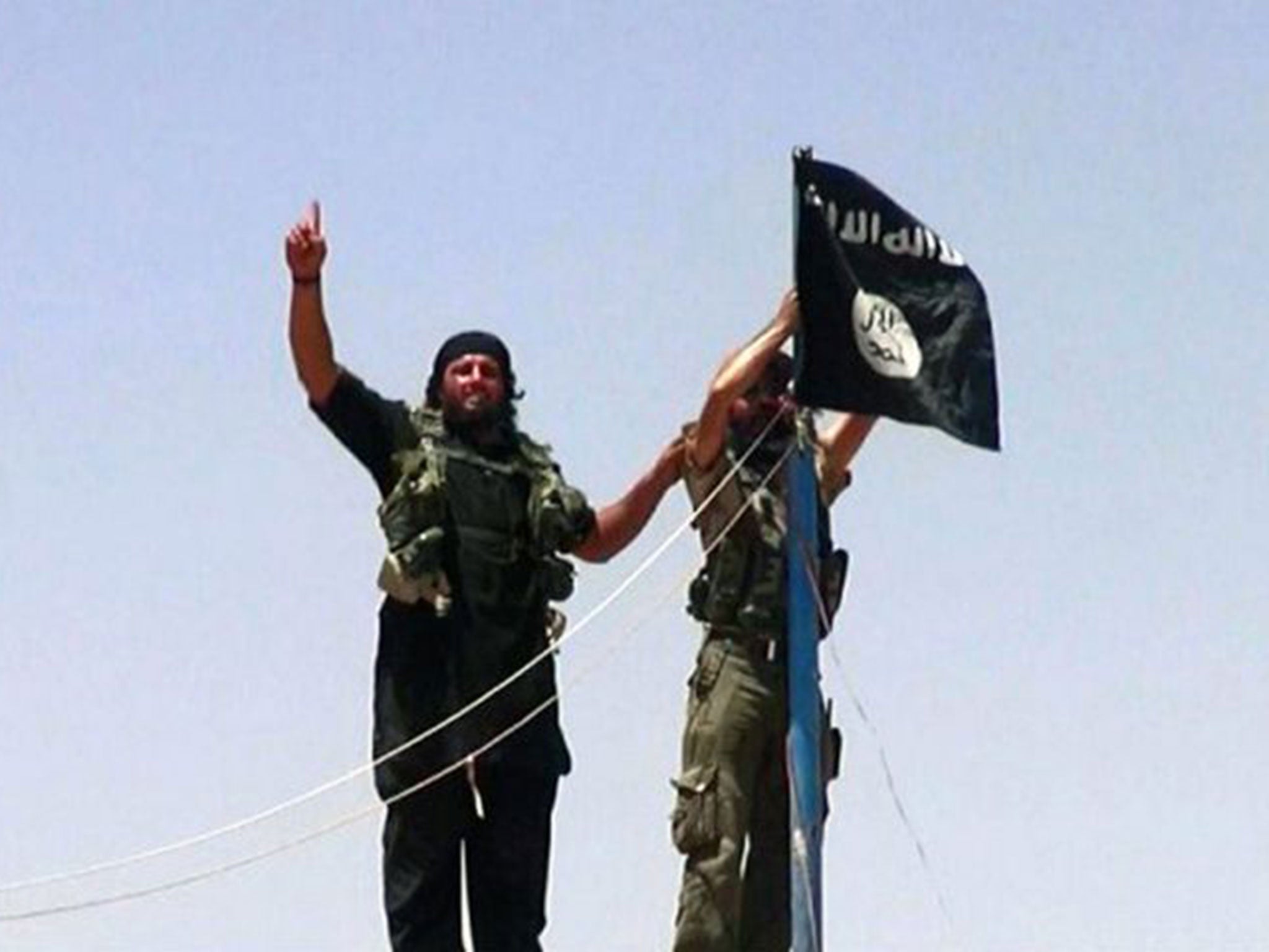 Militants fly the jihadist flag