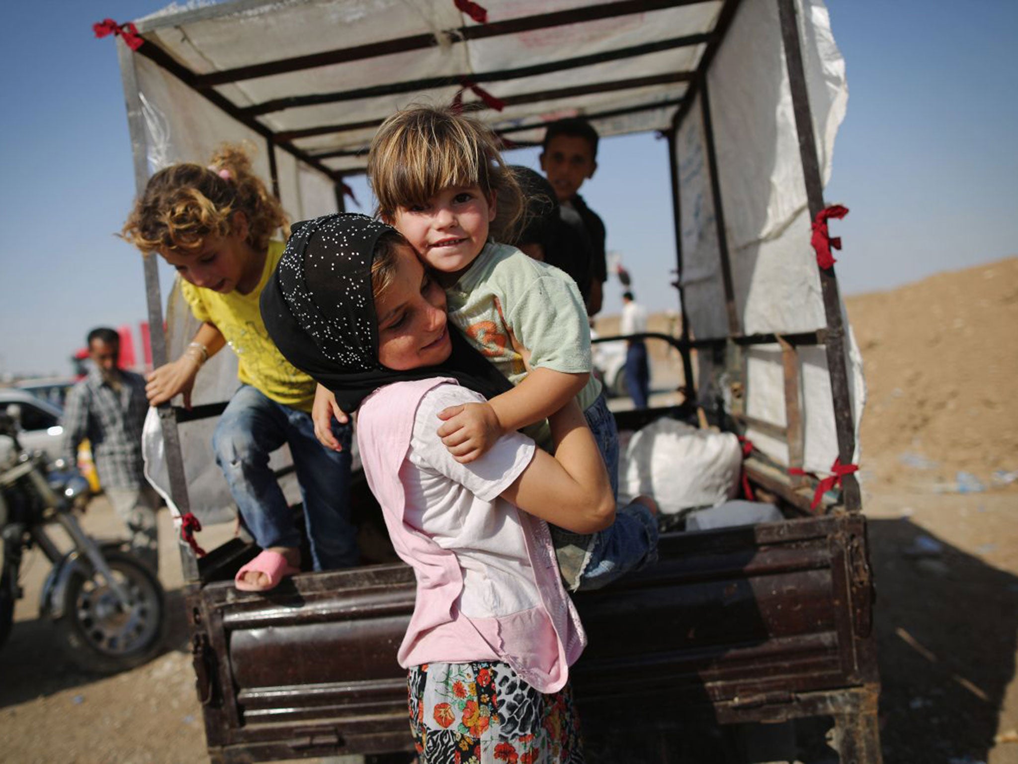 Families arrive at a Kurdish camp (Getty)