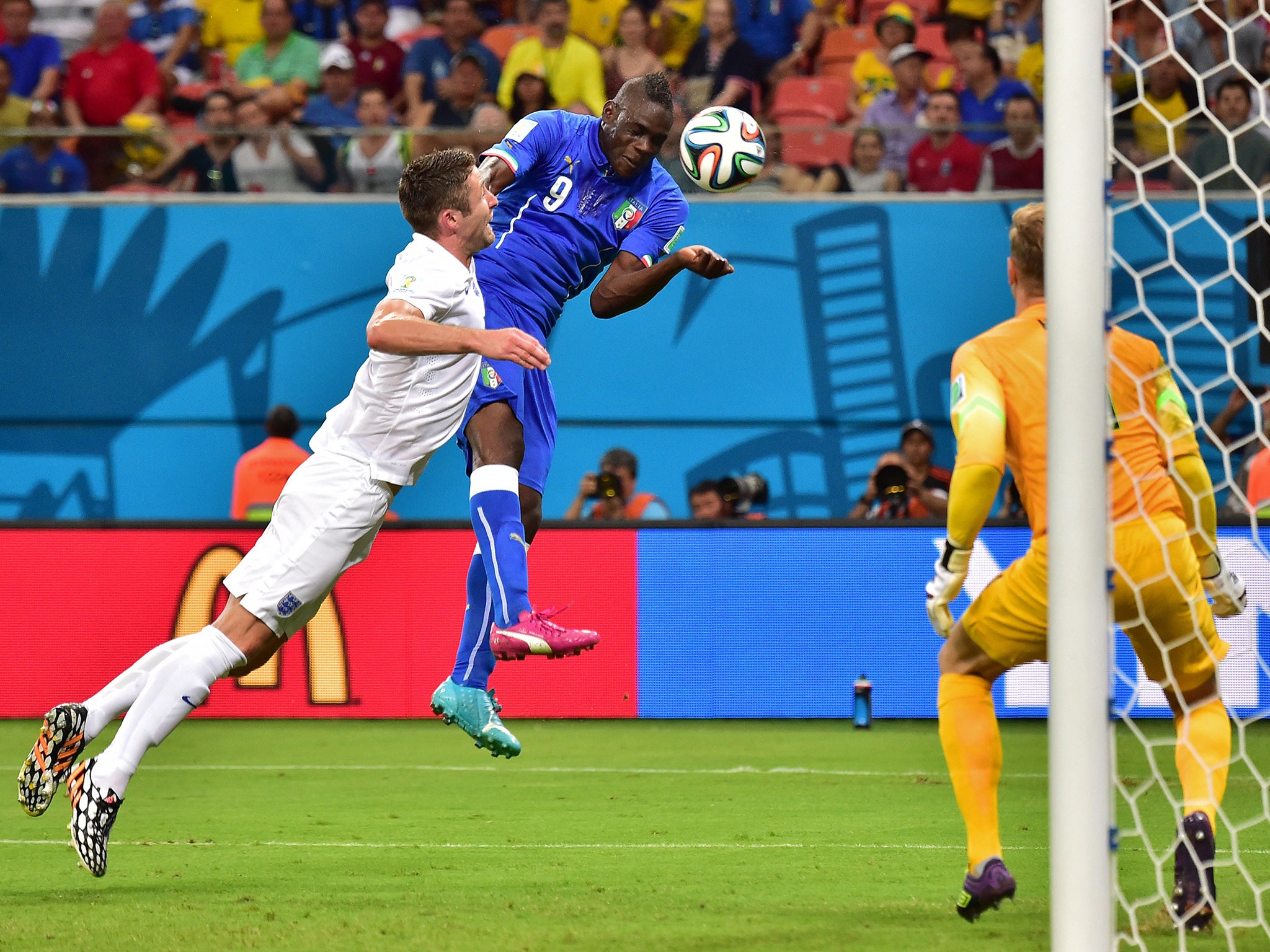 Mario Balotelli heads in Italy's winner against England