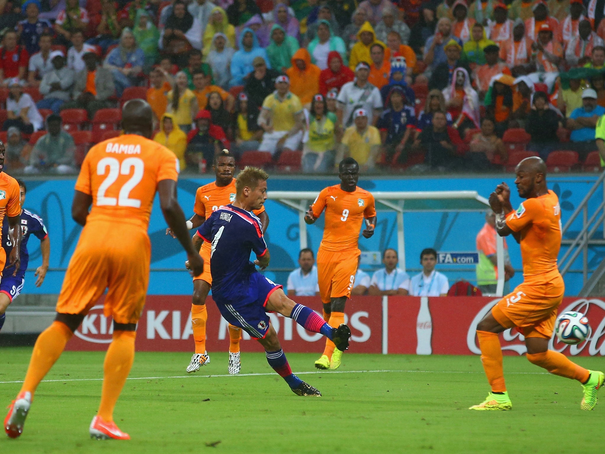 Keisuke Honda scores the opener for Japan with a powerful strike