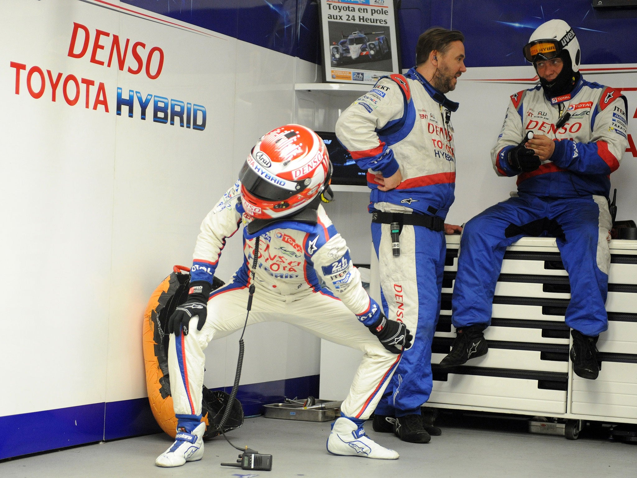 Japanese Kazuki Nakajima (L) (Toyota TS 040 Hybrid N° 7) gestures in his pit