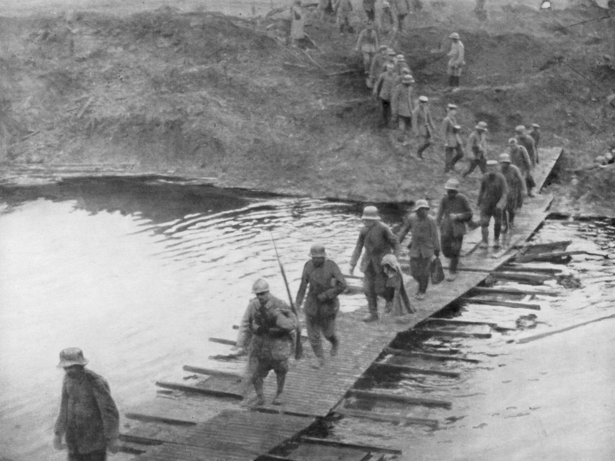 German prisoners on a duckboard track at Yser Canal, Belgium, on the opening day of the battle