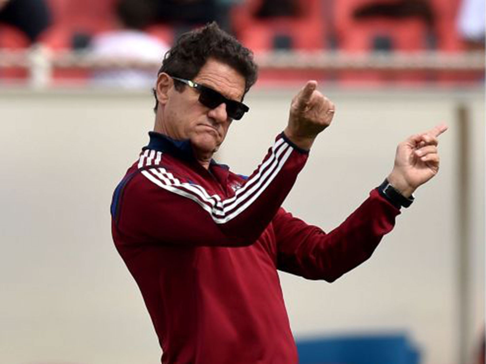 Fabio Capello looks on during a training session with Russia