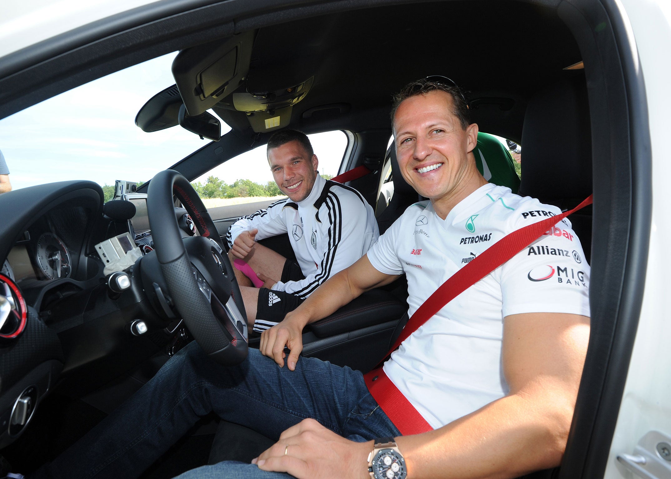 Lukas Podolski and Michael Schumacher, who are close friends, at Germany's Euro 2012 training camp