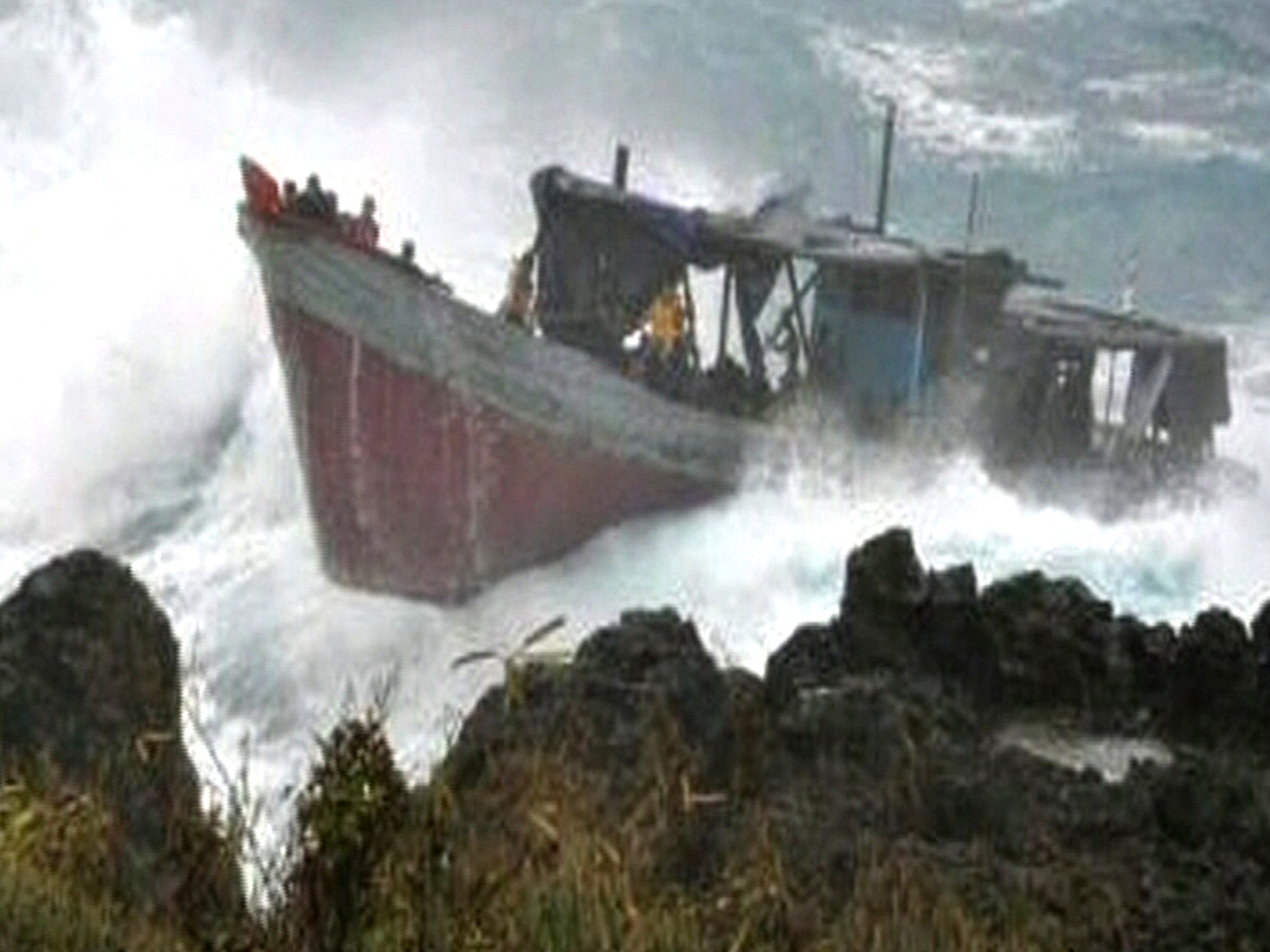 The boat laden with refugees hits the rocks at Christmas Island in 2010