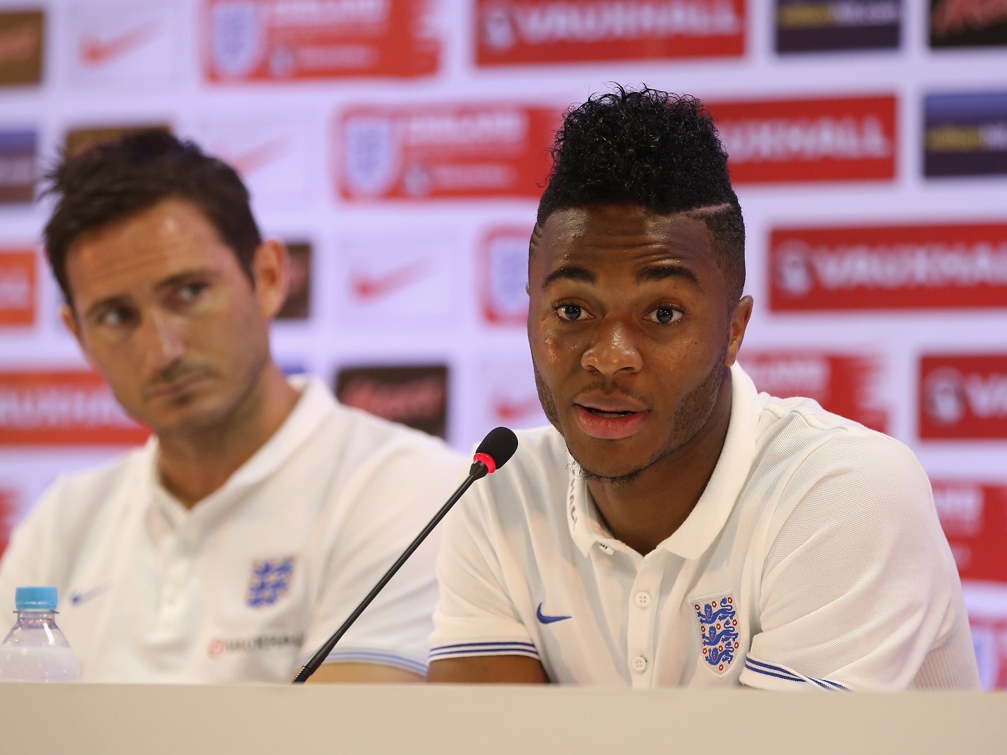 Raheem Sterling talks alongside Frank Lampard