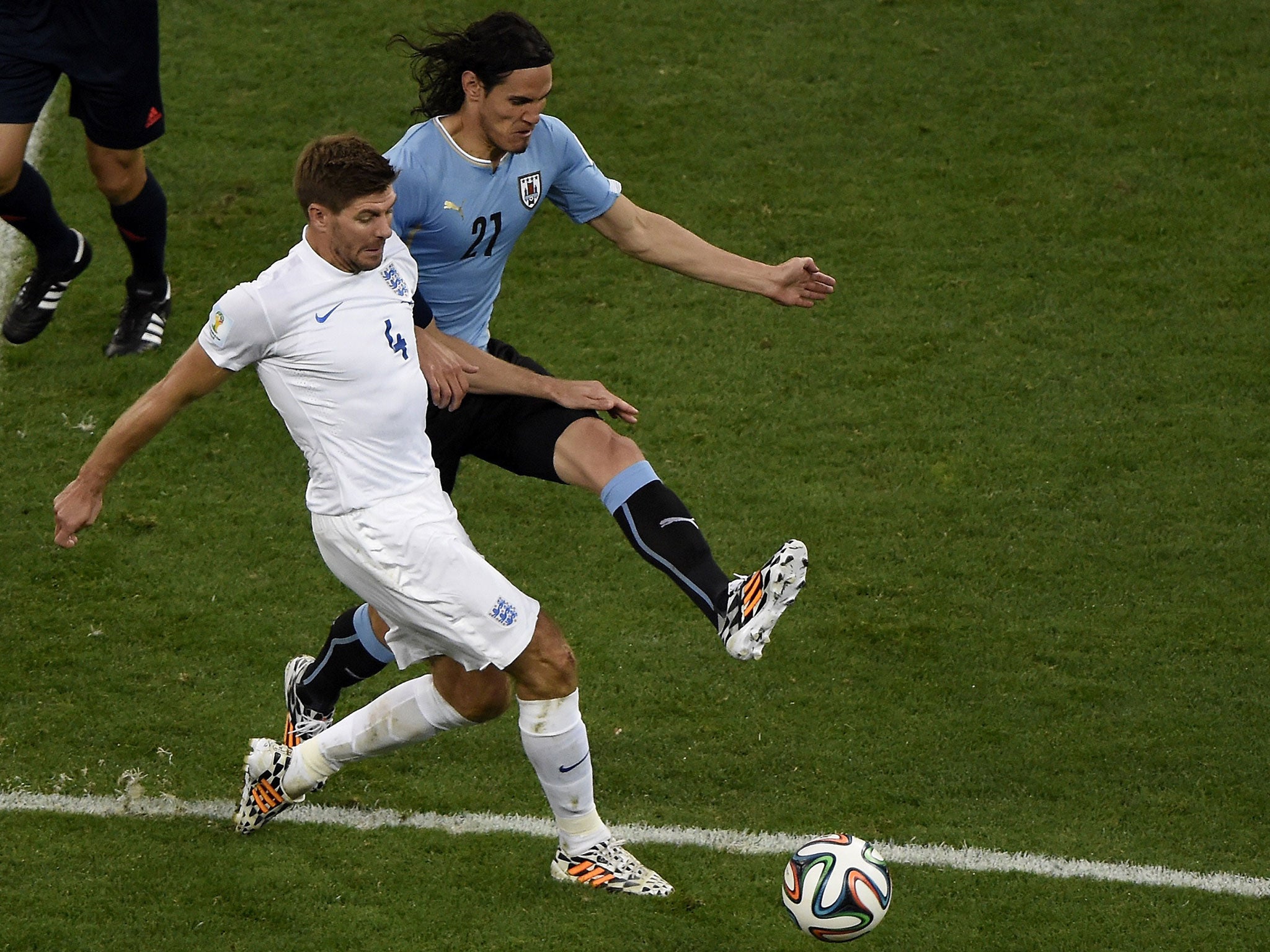 Edinson Cavani tackles Steven Gerrard in Sao Paulo