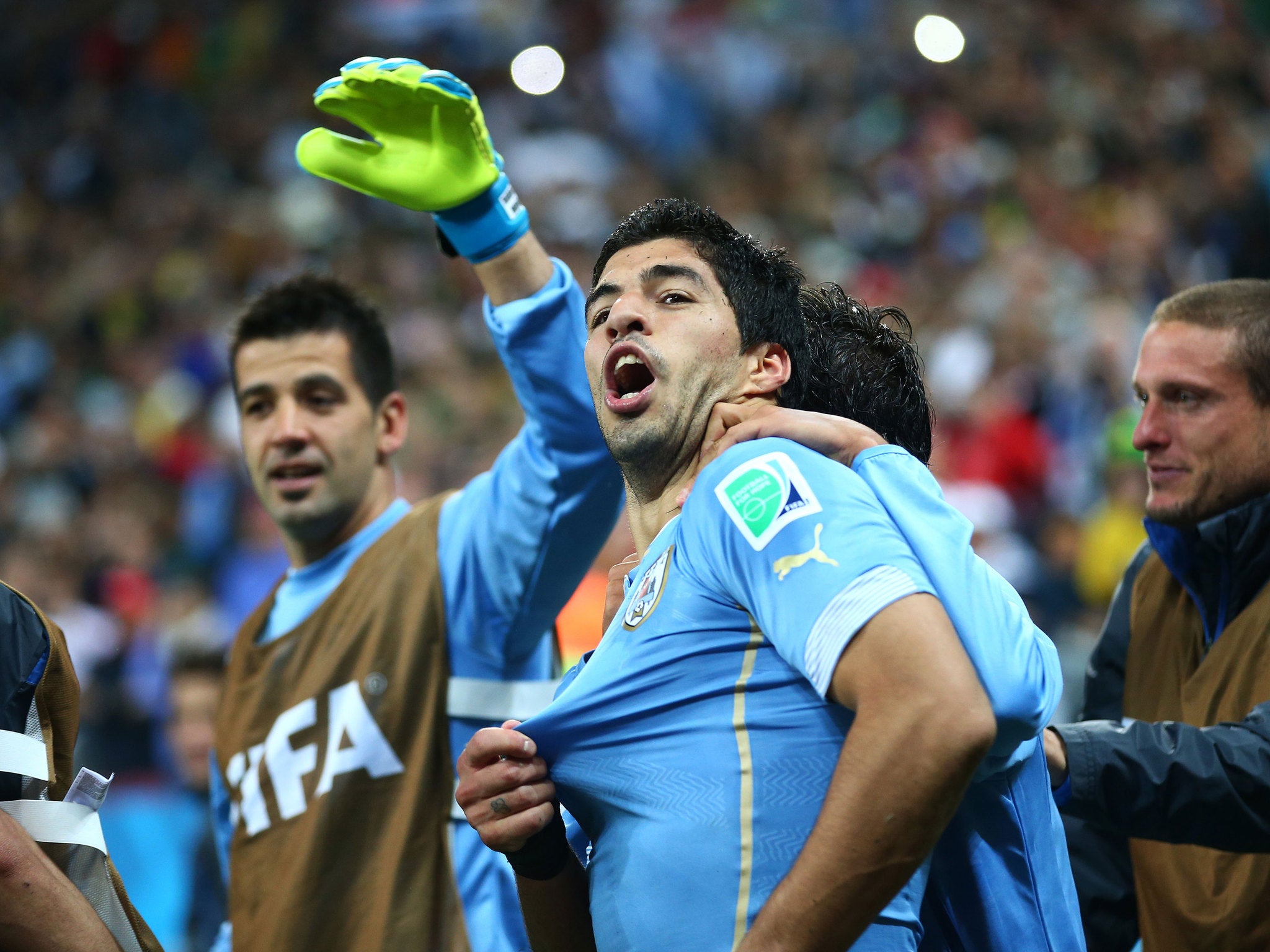 Luis Suarez celebrates after the win against England