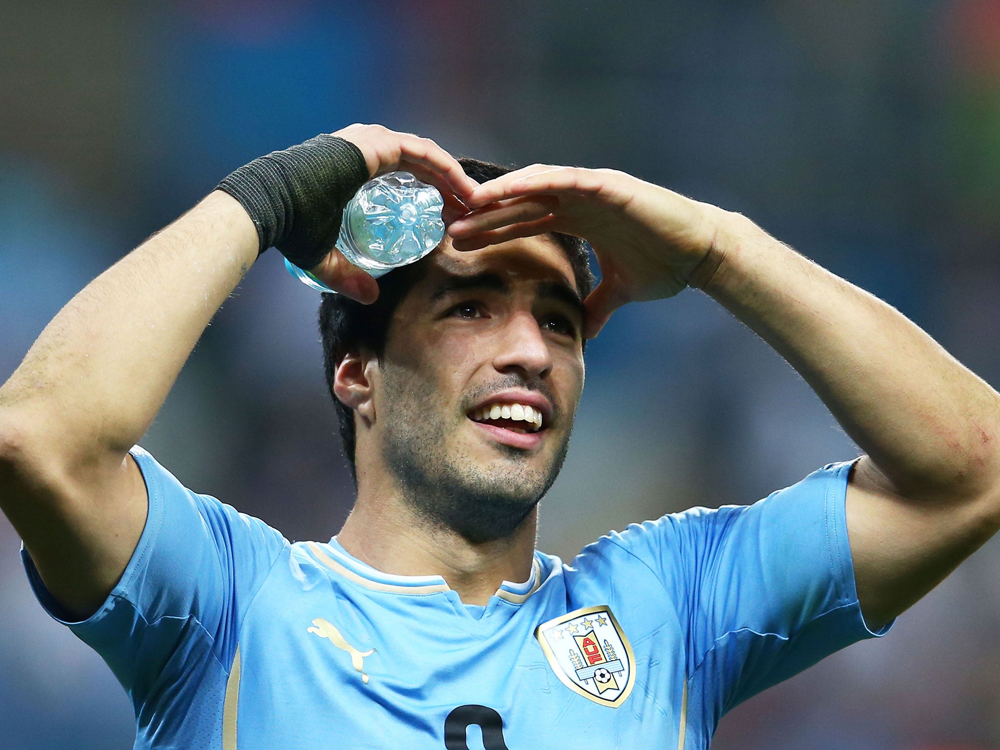 Luis Suarez looks towards the crowd during the 2-1 victory over England