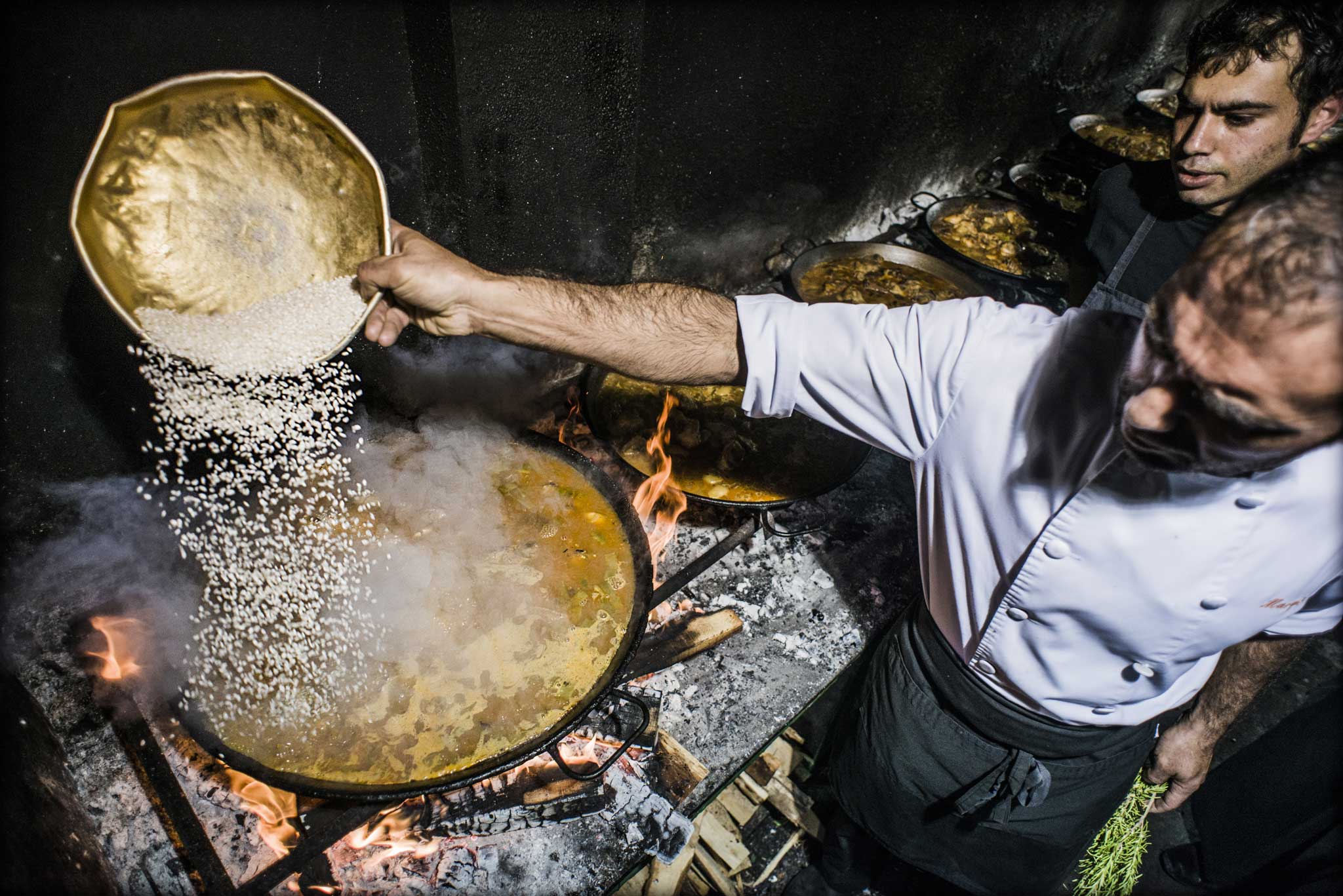 The brothers cook on a medieval furnace lined with wood-burning fires, each with a pan bubbling away over it