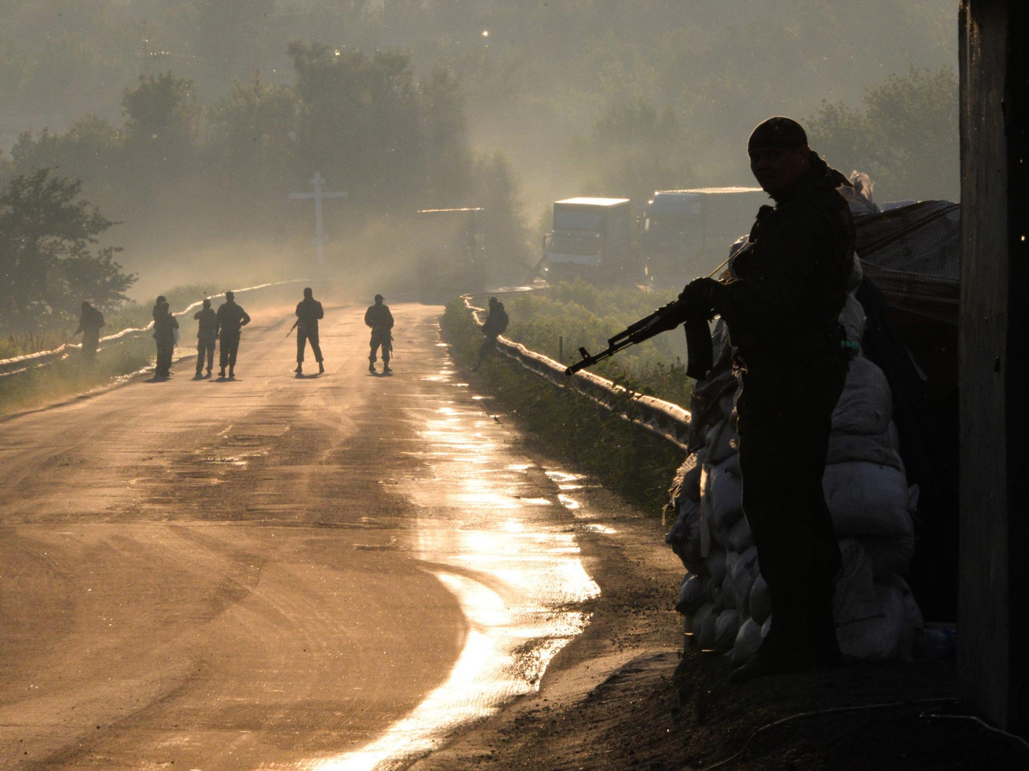 Pro-Russian militants guarding on a street near the village of Karlivka, near Donetsk, Ukraine