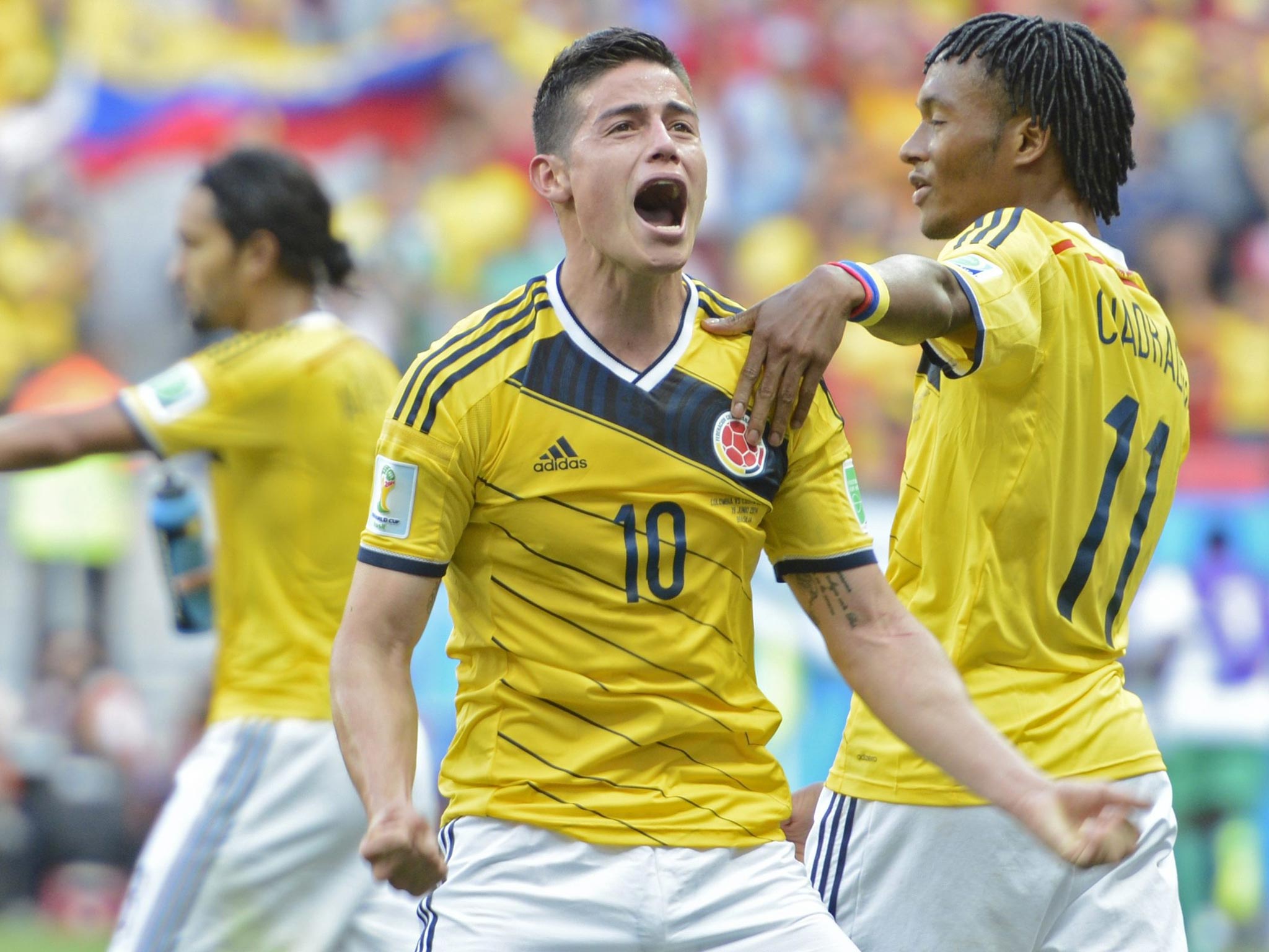 James Rodriguez (centre) celebrates after scoring Colombia’s first goal in their 2-1 win over Ivory Coast