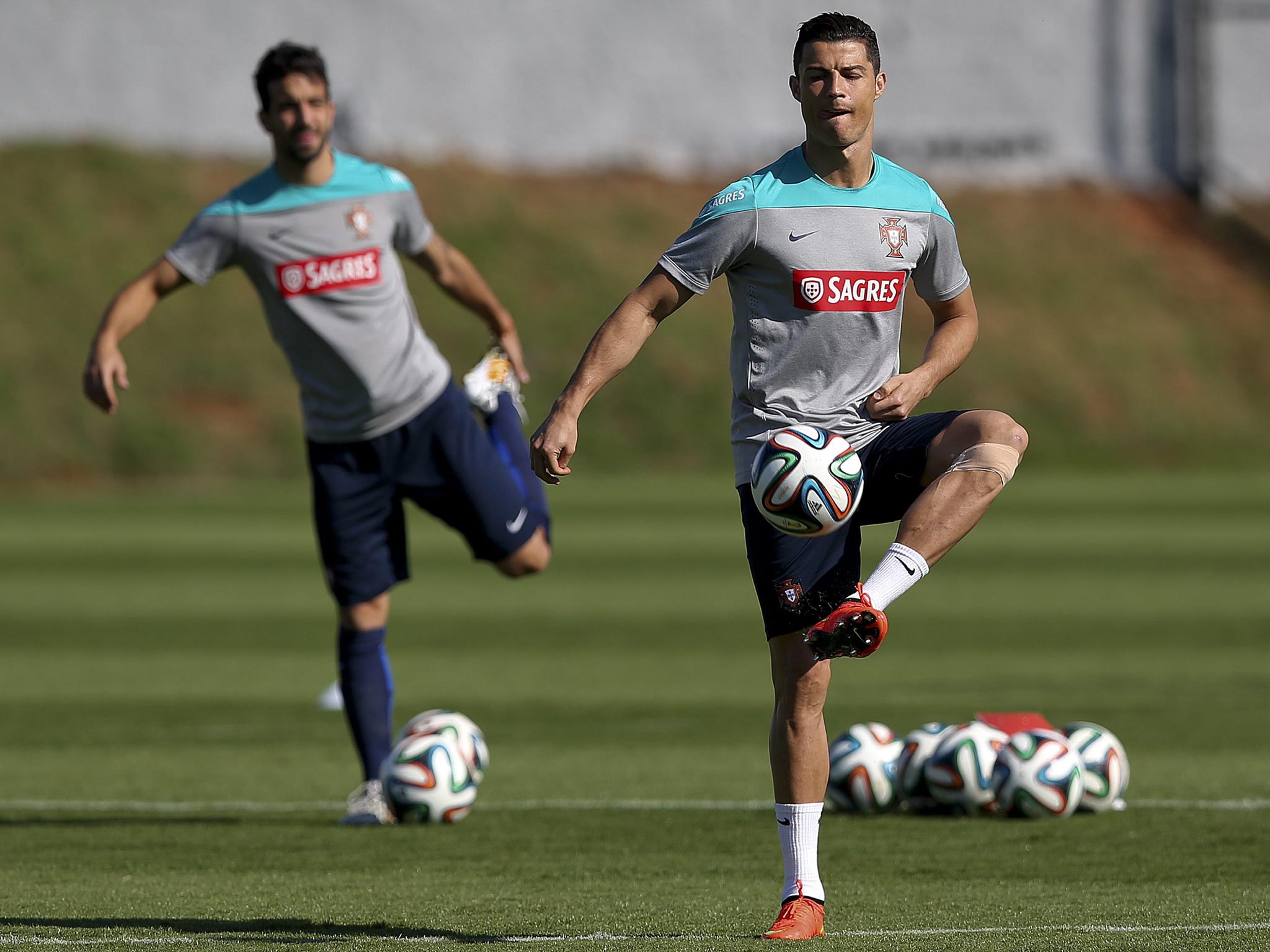 Cristiano Ronaldo during training yesterday, with his
left knee strapped up