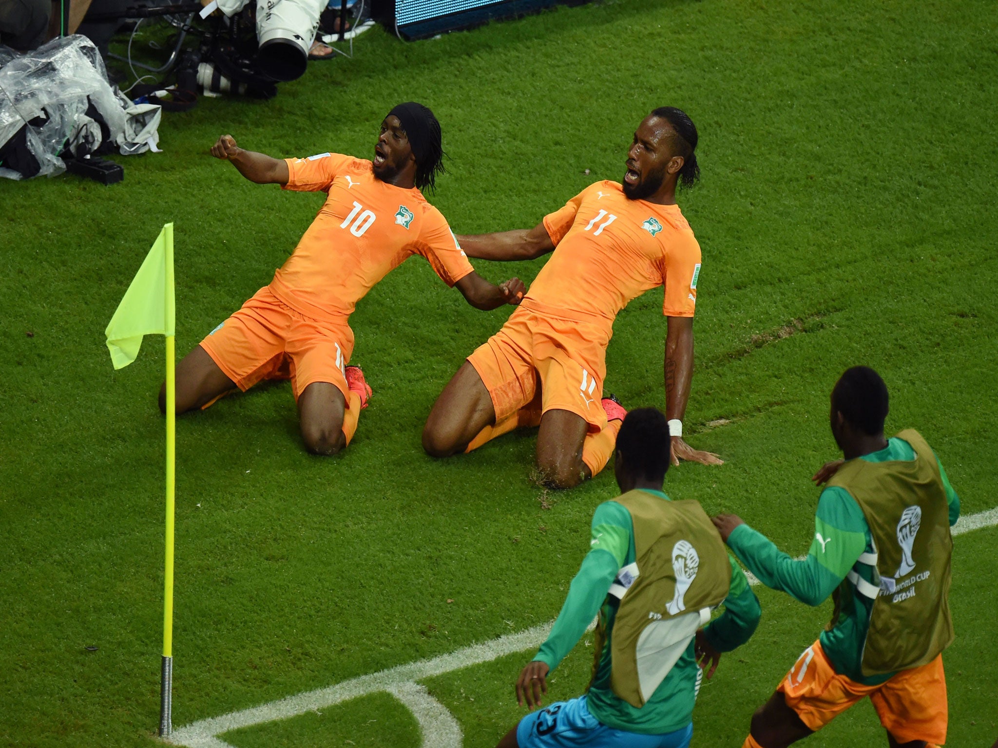 Didier Drogba celebrates with Gervinho at the World Cup