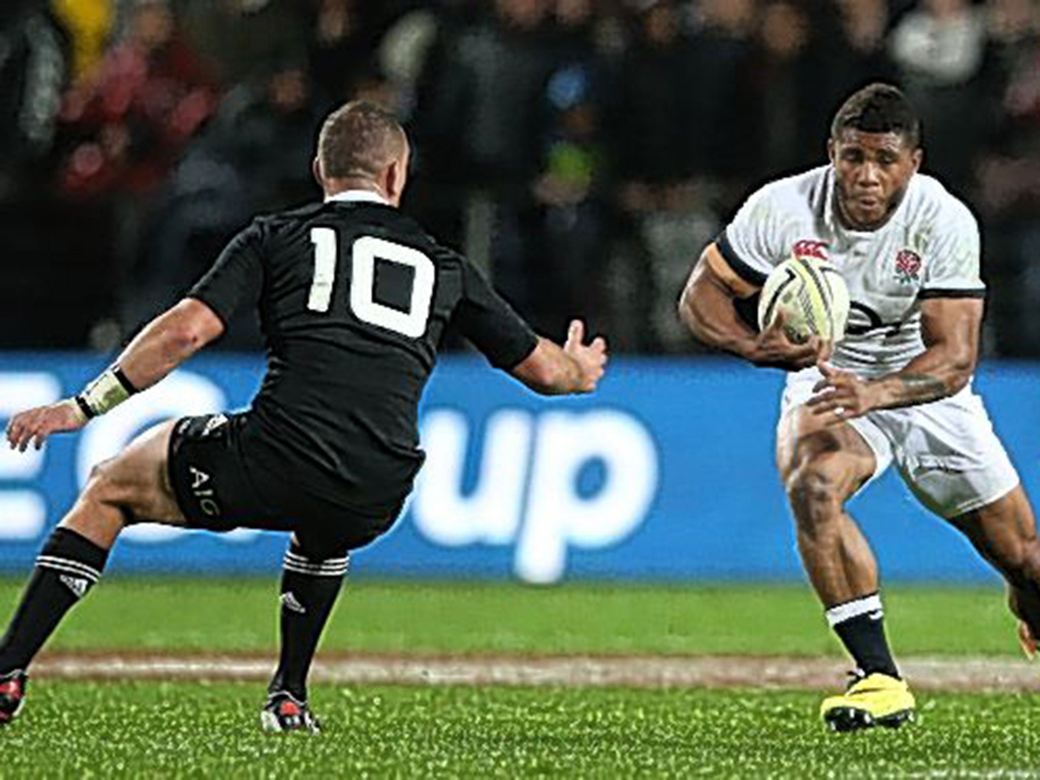 Ten pounder: Kiwi fly-half Aaron Crudden gets ready to stop Kyle Eastmond of England