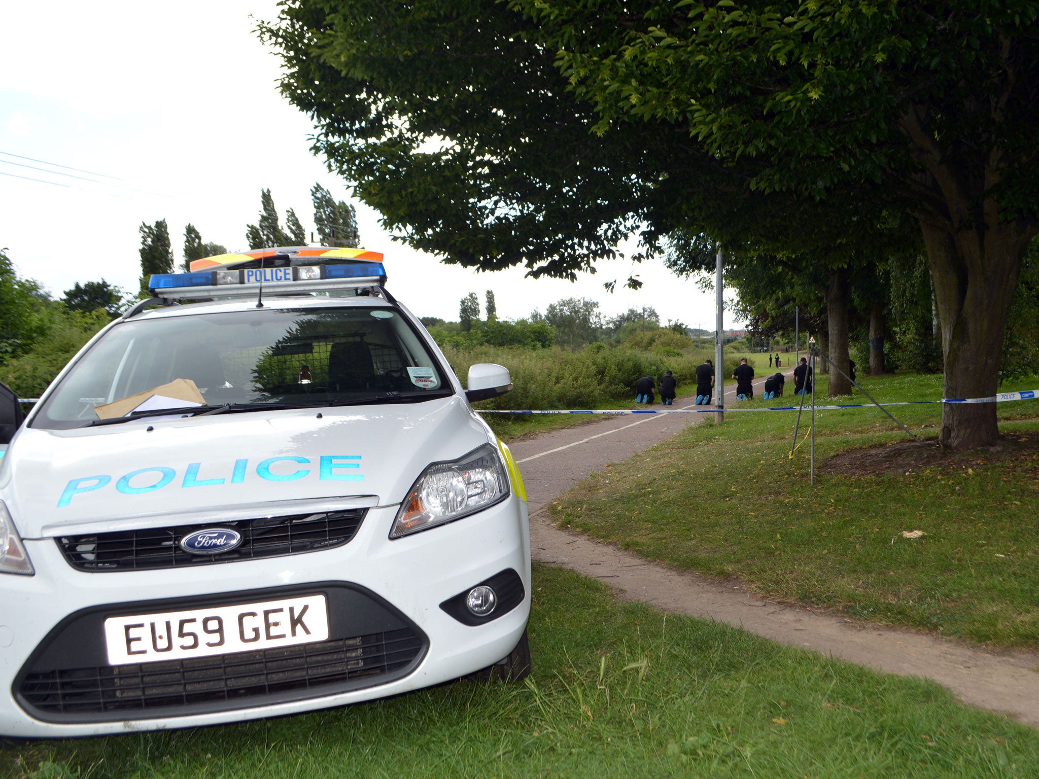 Police search the scene at Salary Brook Trail in Colchester