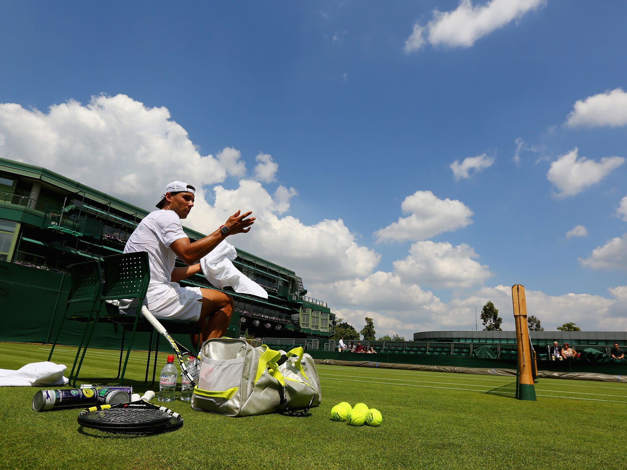 Rafael Nadal soaks up the sunshine at SW19 during a practice session