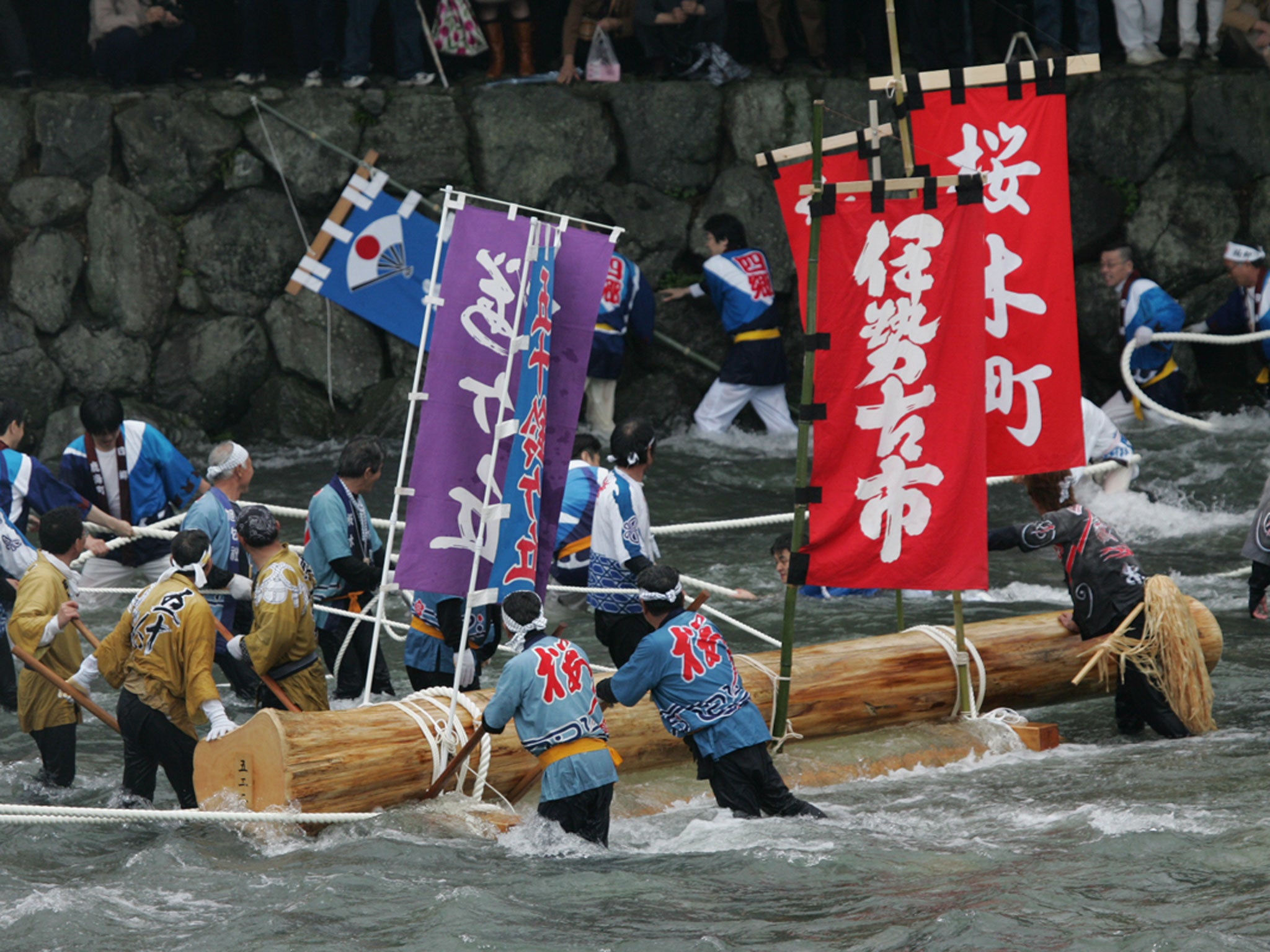 The trees are ceremonially felled and transported down the sacred river