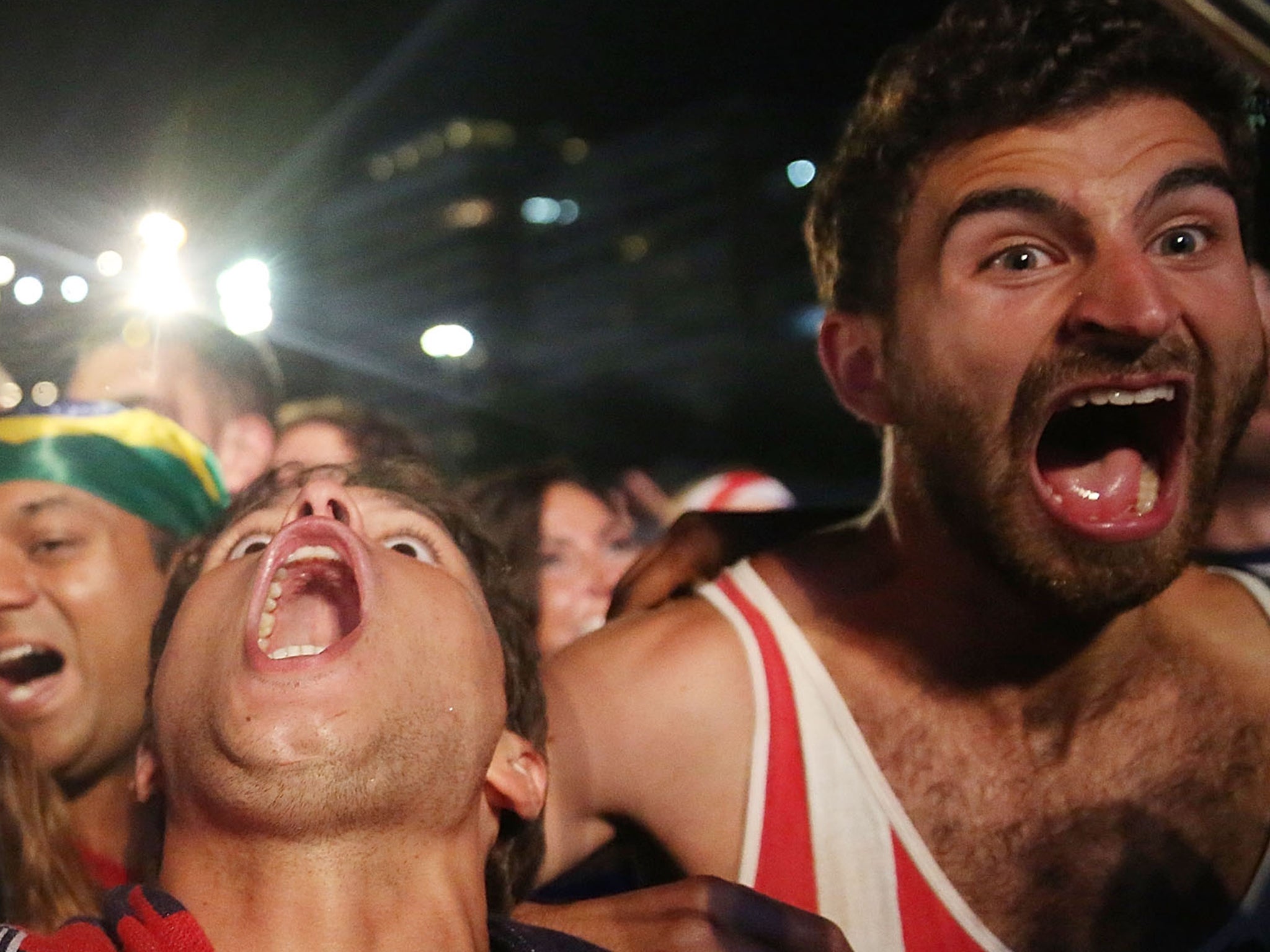 A couple of supporters celebrate a USA goal at a fan park in Chicago