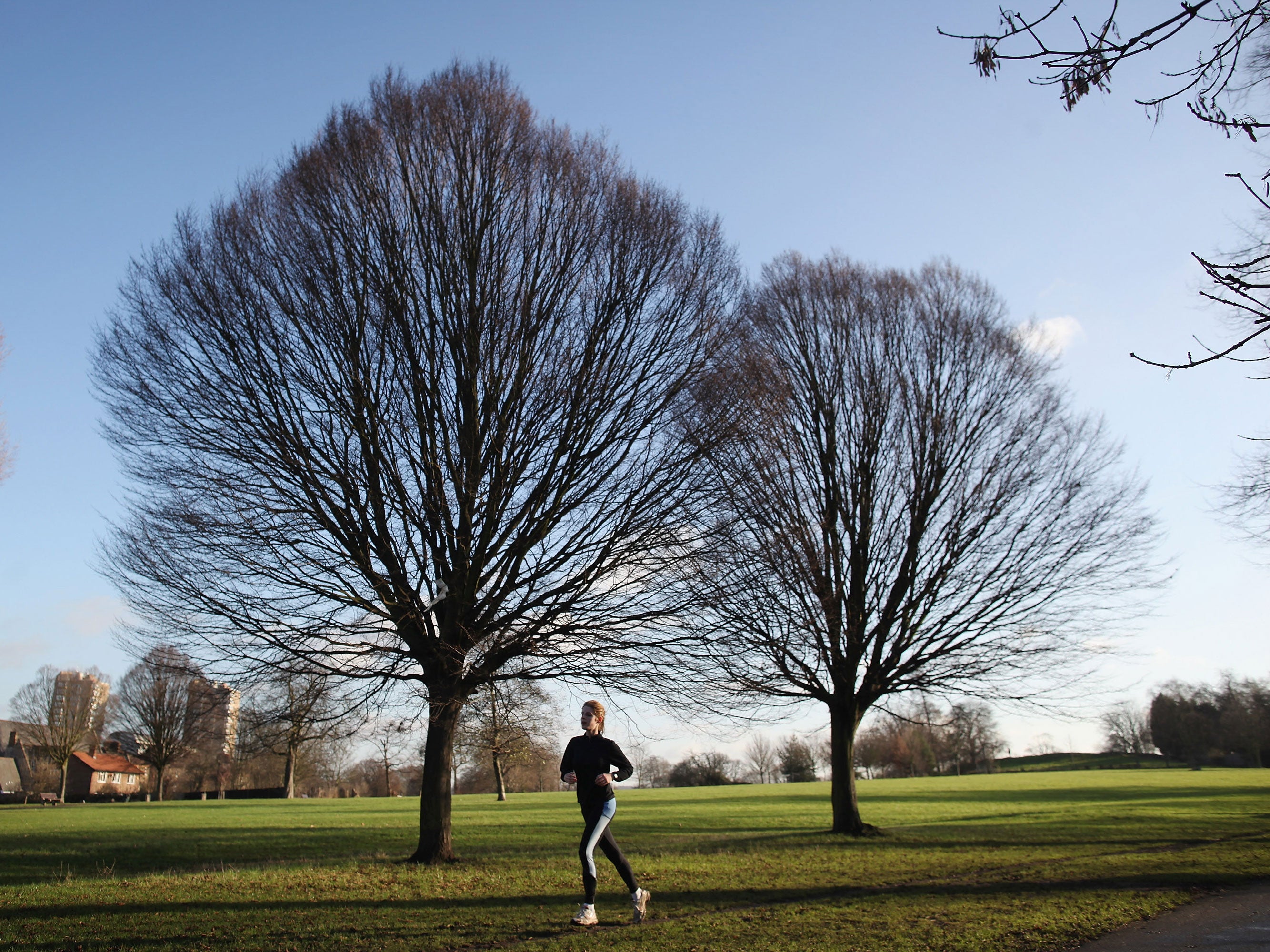 A woman jogs in Brockwell in London, England.