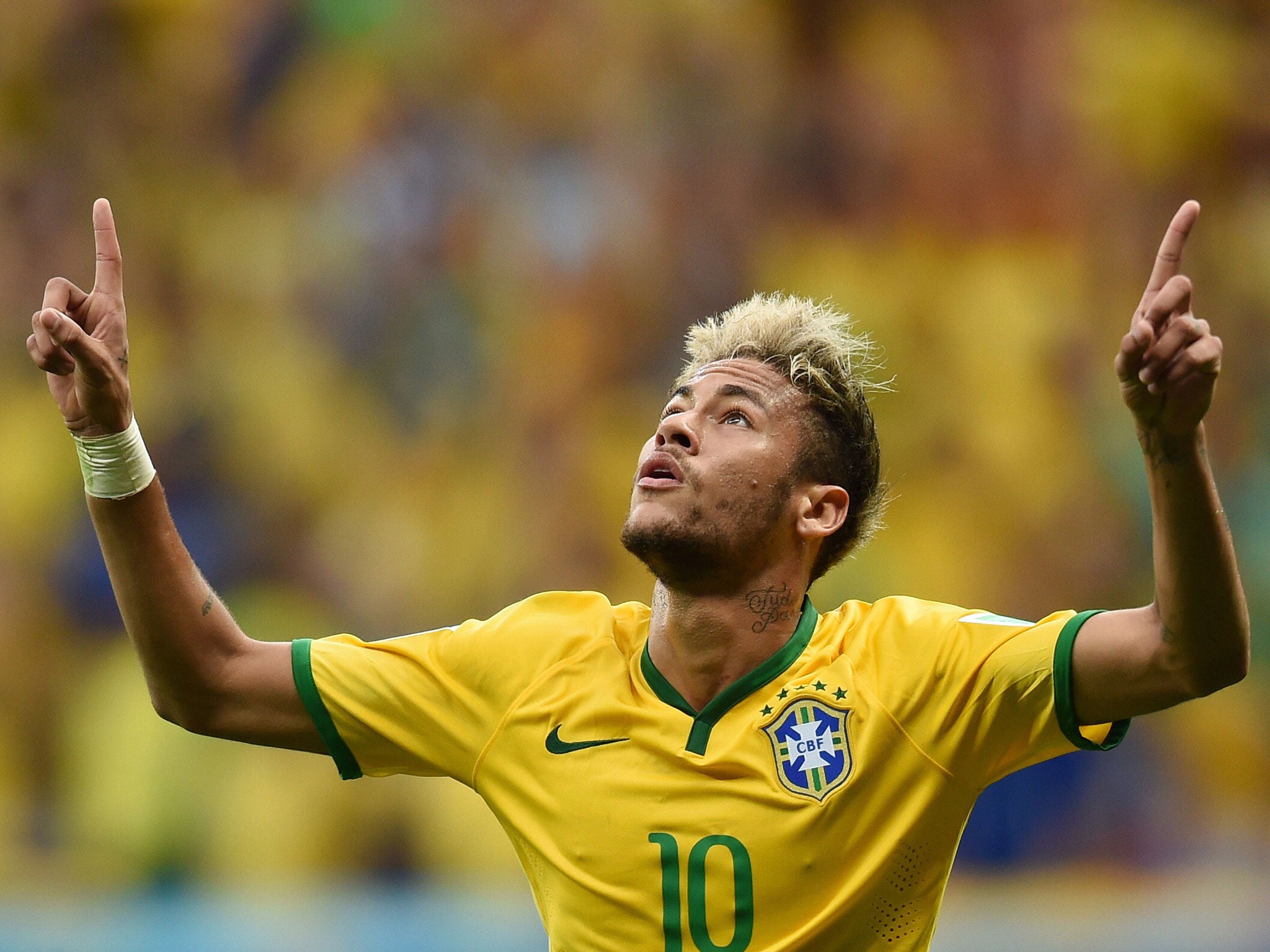 Brazil's forward Neymar celebrates after scoring a second goal