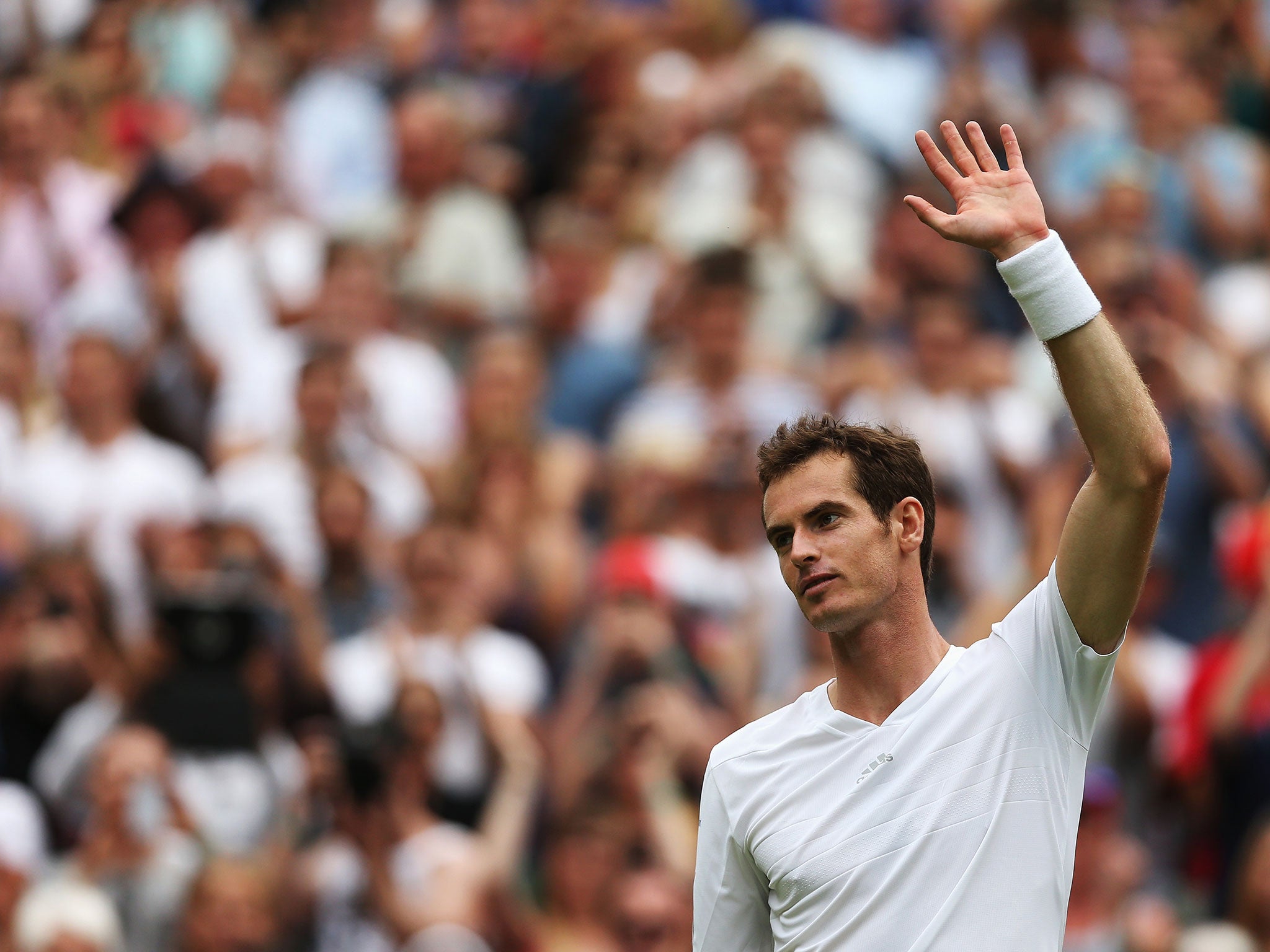 Andy Murray of Great Britain acknowledgese the fans after winning his Gentlemen's Singles first round match against David Goffin of Belgium on day one of the Wimbledon