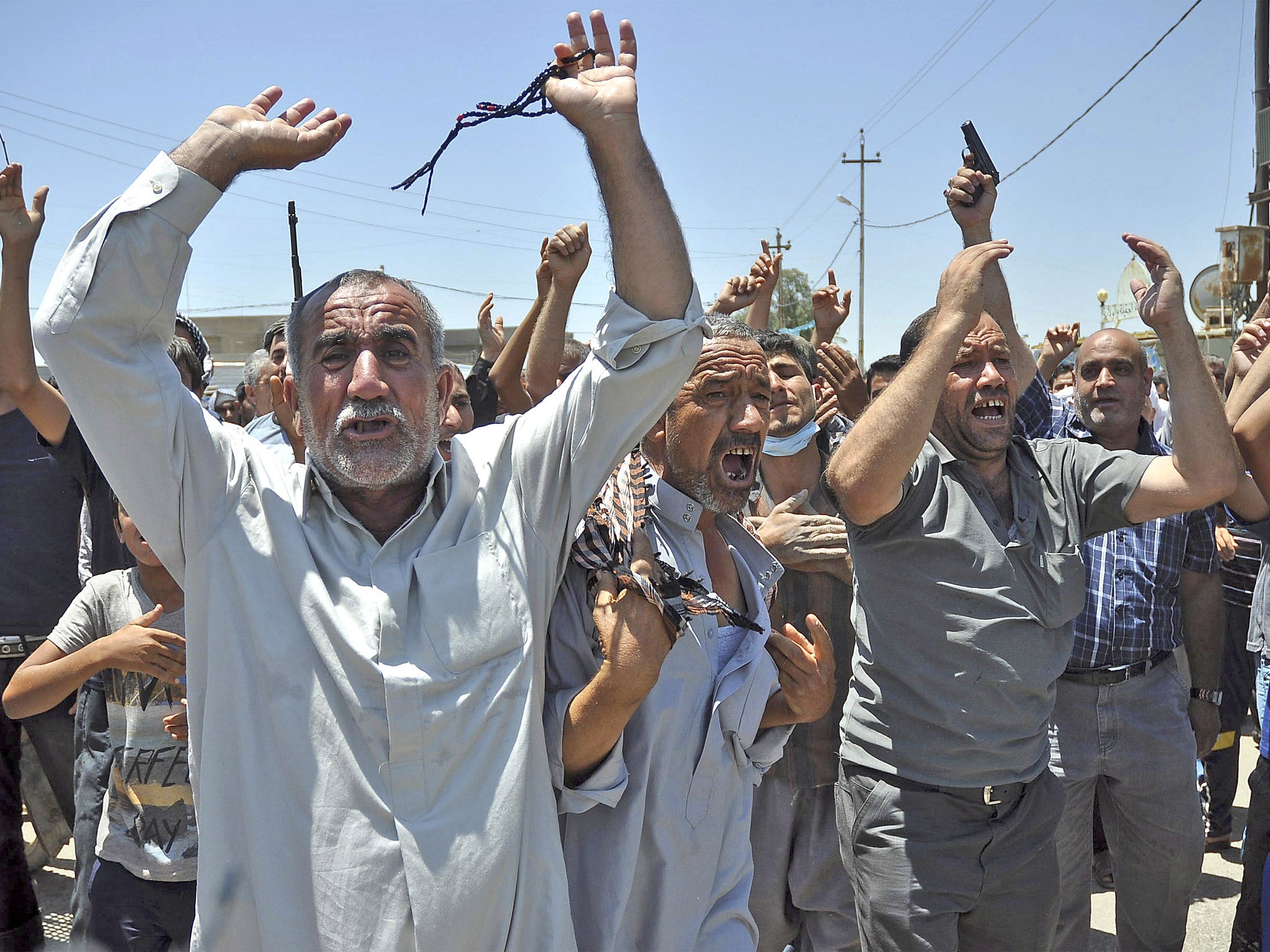 Mourners burying 15 bodies in the village of Taza Khormato, near the northern city of Kirkuk