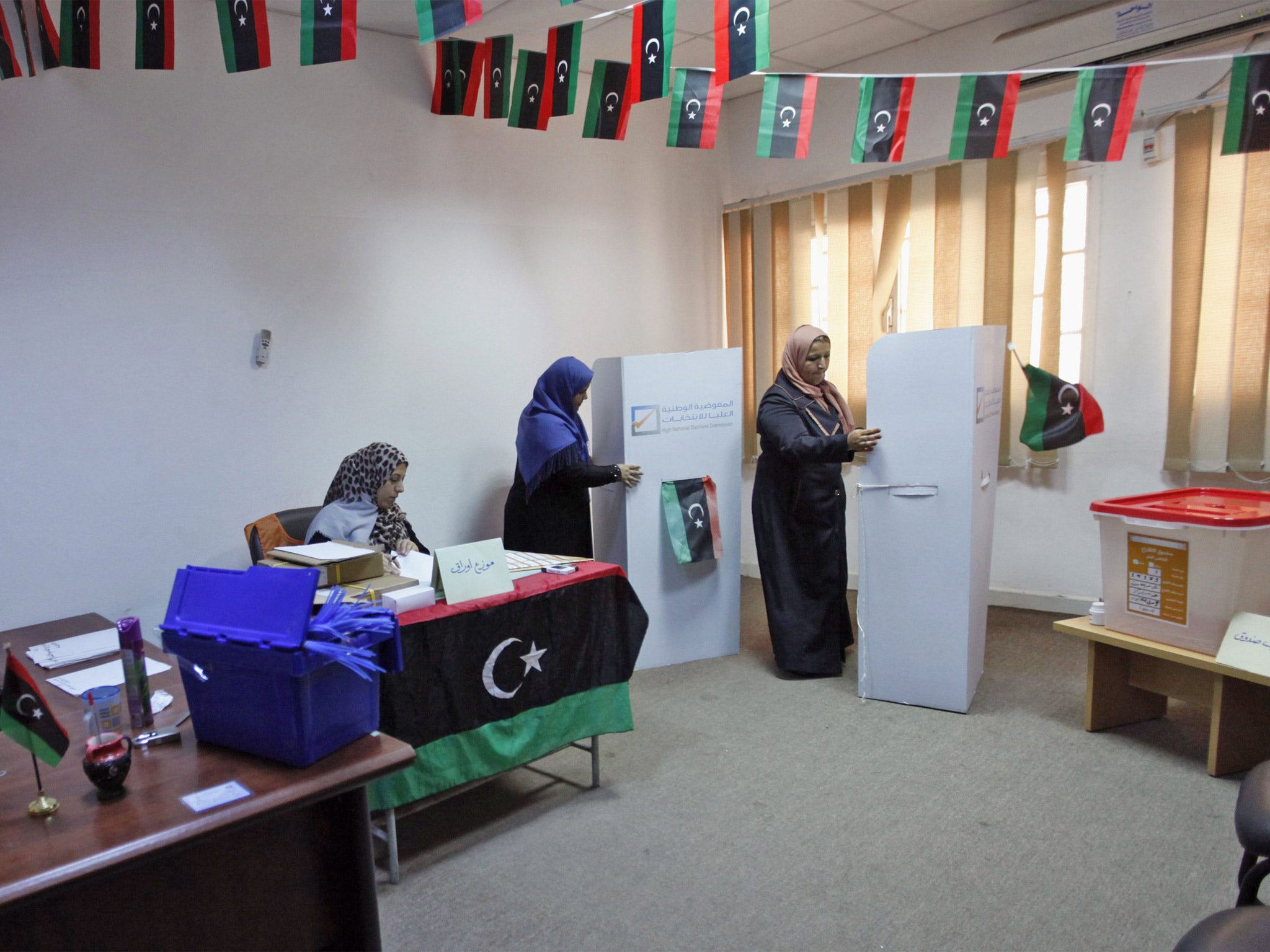 Election officials make preparations inside a Tripoli school