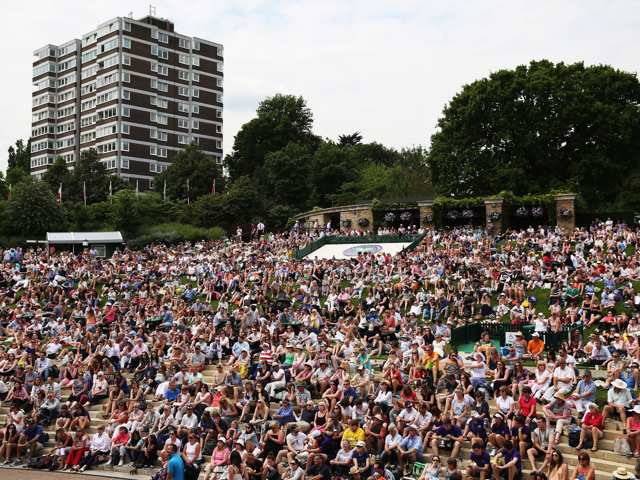 Crowds gather on Murray Mound at Wimbledon, 2014.