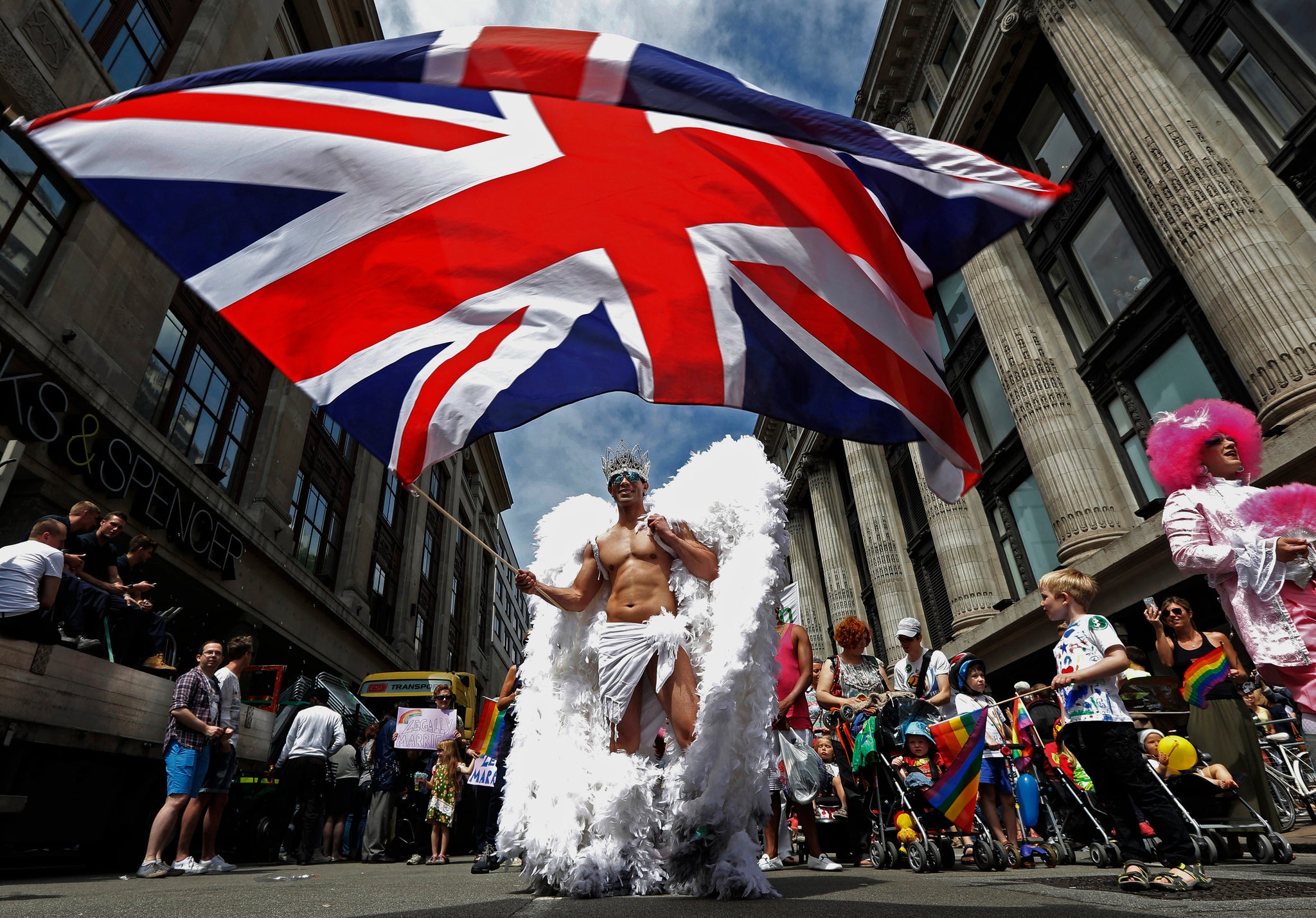 A member of the Pride parade in 2013 proudly waves the British flag