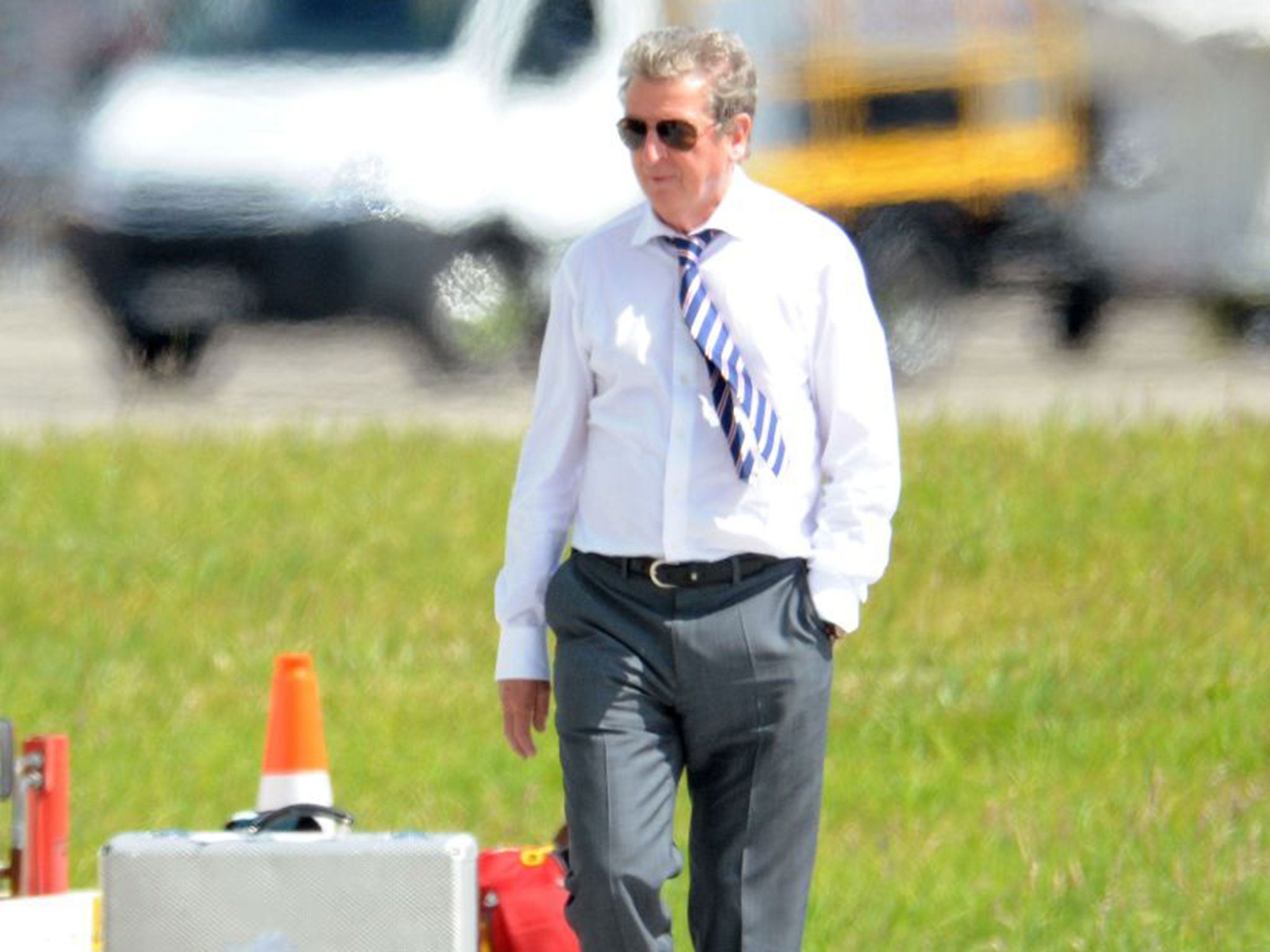 Roy Hodgson arrives at Luton airport