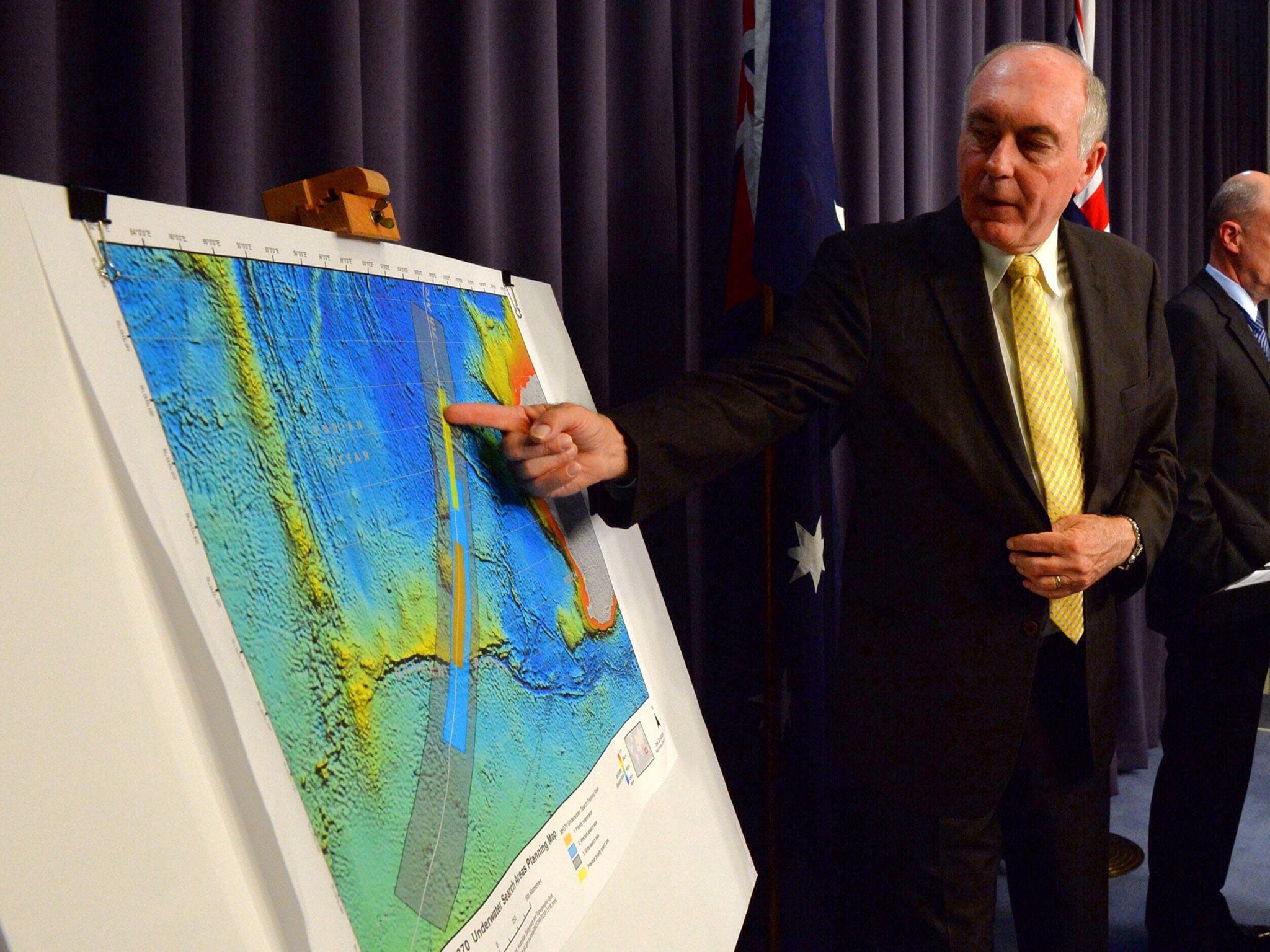 Australian Deputy Prime Minister Warren Truss shows the new search area in the Indian Ocean for missing Malaysia Airlines flight MH370