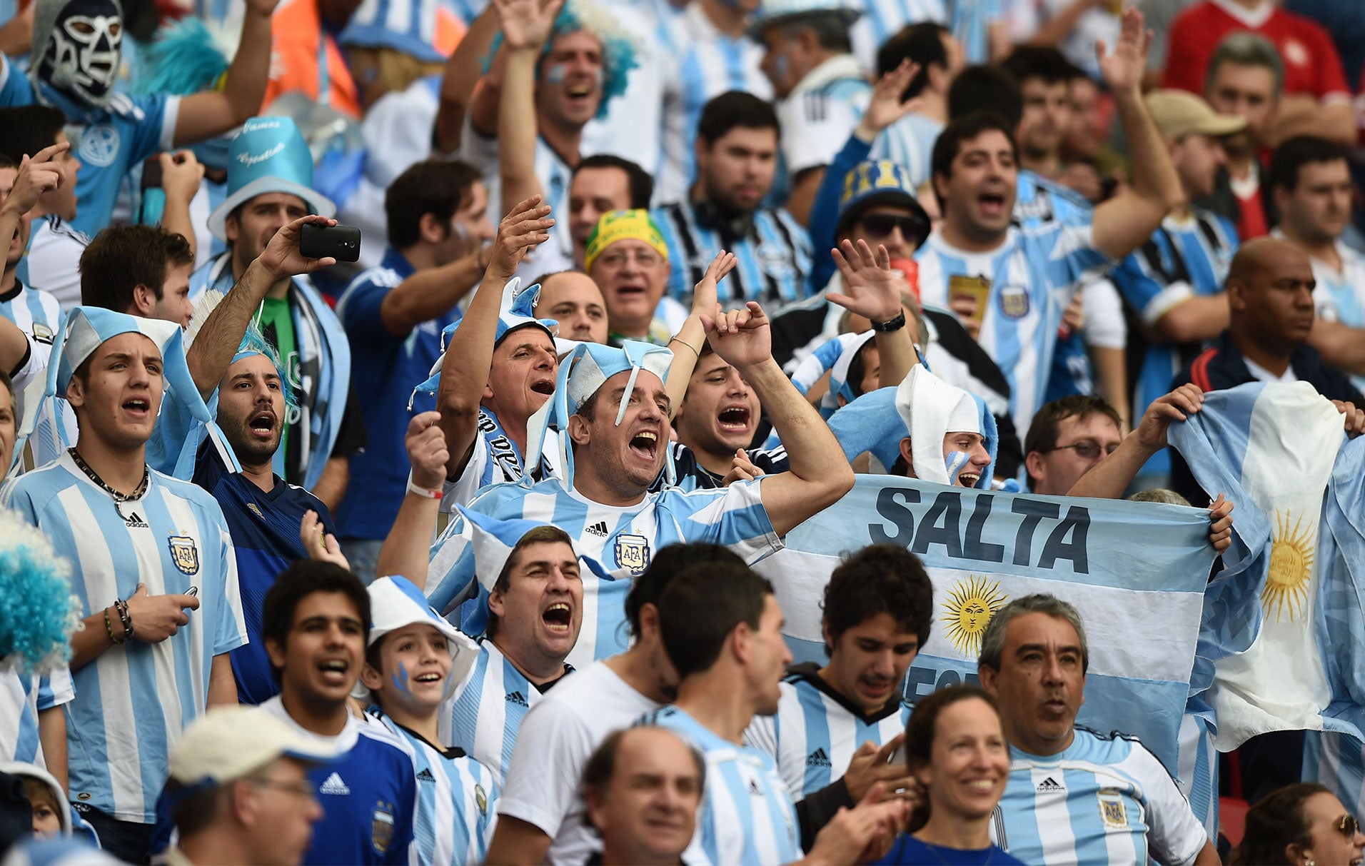 Argentina's supporters cheer for their team ahead of the Group F football match between Nigeria and Argentina at the Beira-Rio Stadium in Porto Alegre on June 25, 2014,during the 2014 FIFA World Cup.